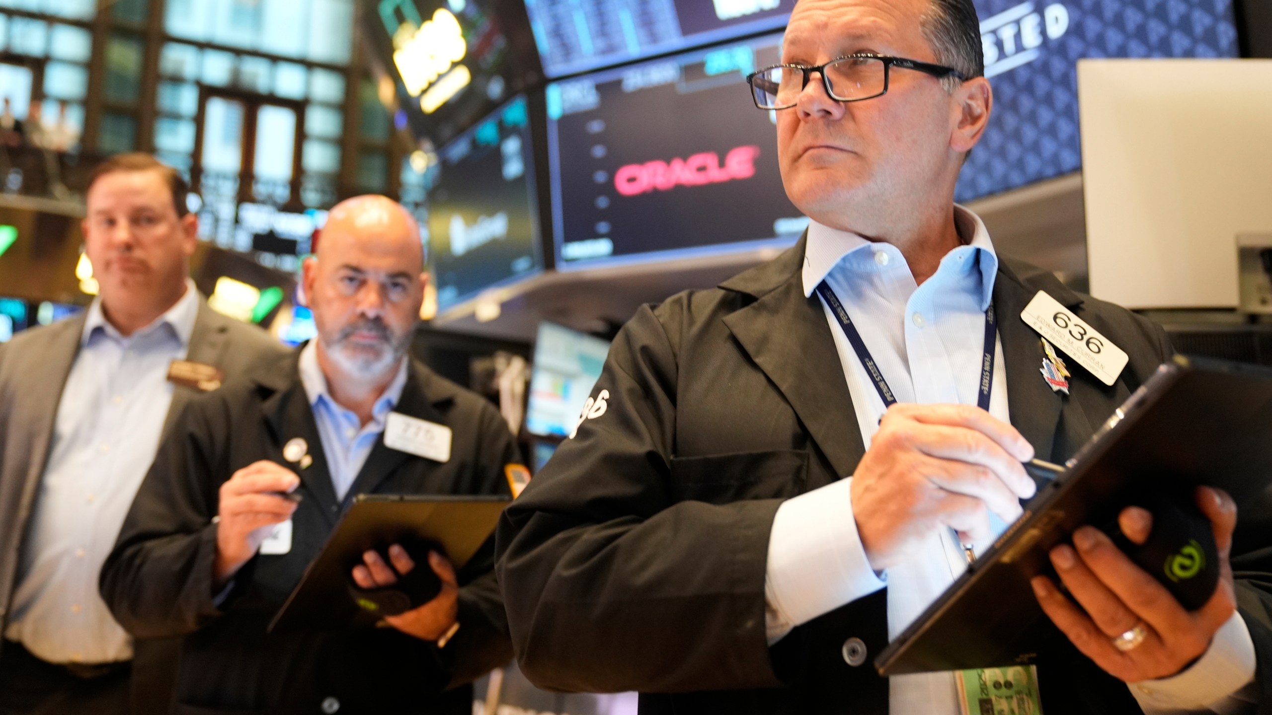 Ed Curran works on the floor at the New York Stock Exchange in New York, Wednesday, July 16, 2025. (AP Photo/Seth Wenig)