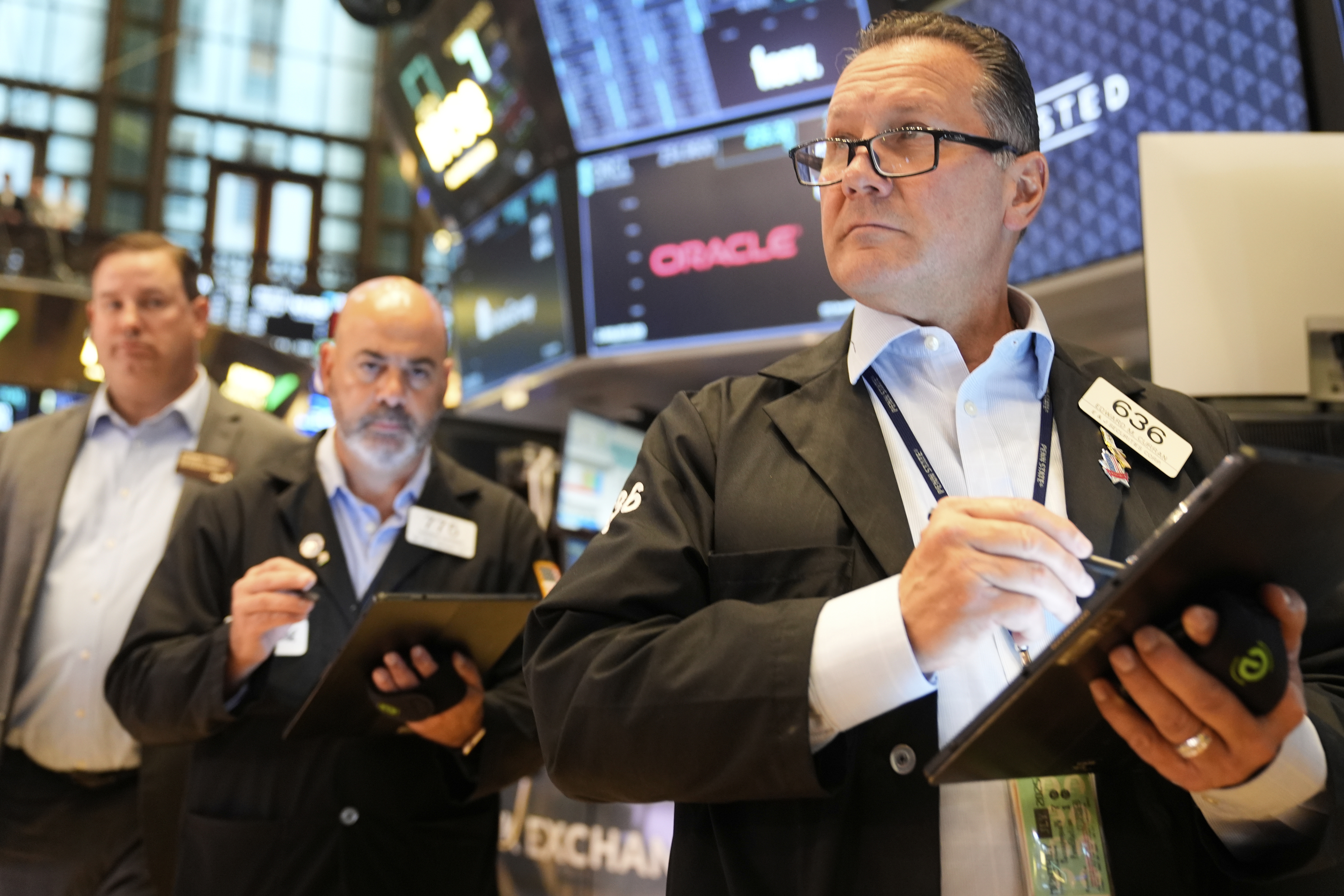 Ed Curran works on the floor at the New York Stock Exchange in New York, Wednesday, July 16, 2025. (AP Photo/Seth Wenig)