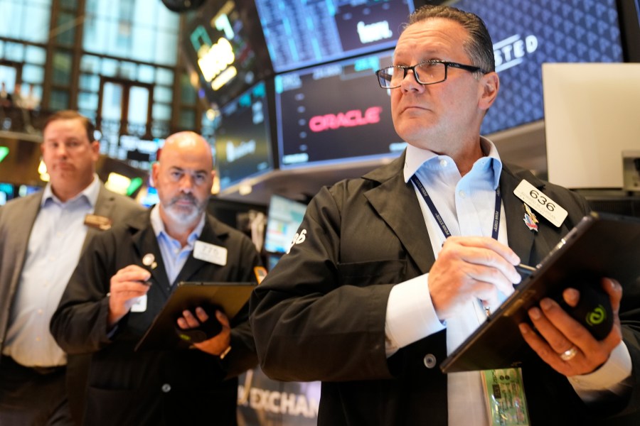 Ed Curran works on the floor at the New York Stock Exchange in New York, Wednesday, July 16, 2025. (AP Photo/Seth Wenig)