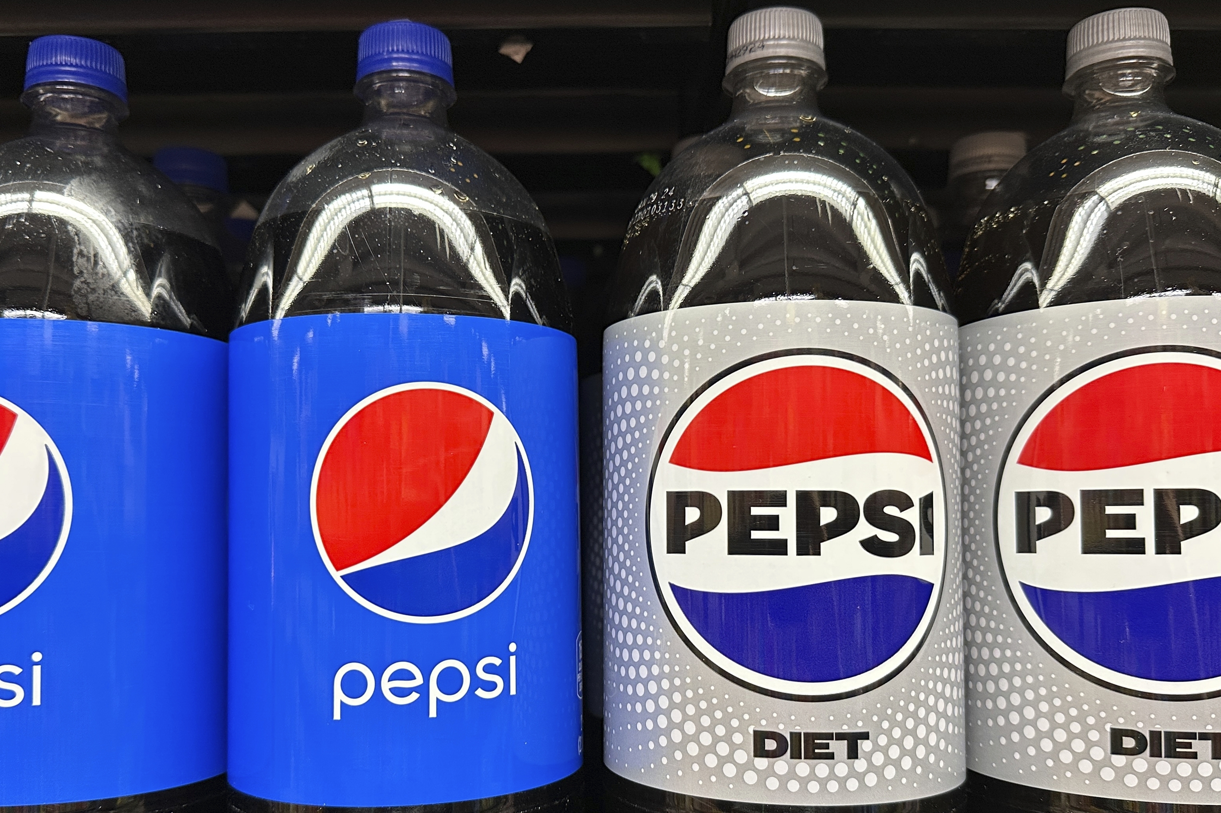 FILE - Plastic bottles of Pepsi are displayed at a grocery store in New York on Nov. 15, 2023. (AP Photo/Ted Shaffrey, File)