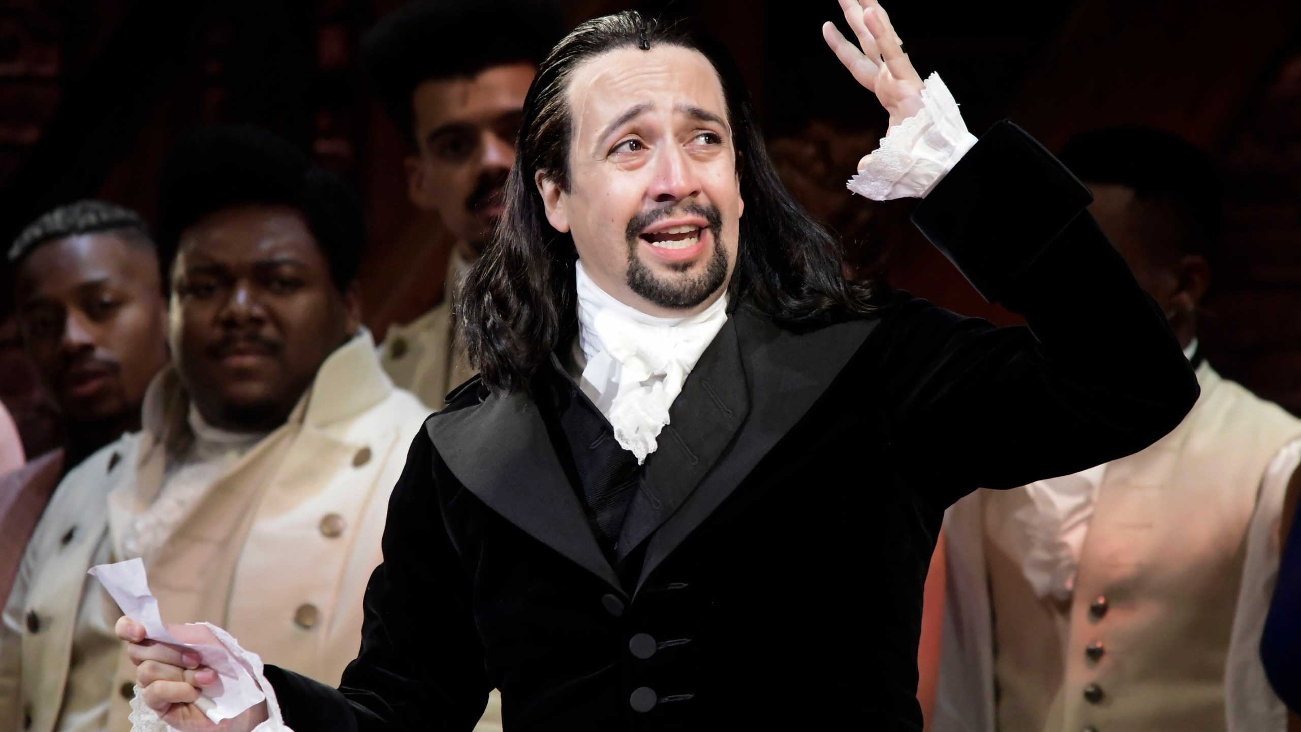 Lin-Manuel Miranda, composer and creator of the award-winning Broadway musical, Hamilton, offers a message of gratitude after receiving a standing ovation at the end of the play's premiere held at the Santurce Fine Arts Center, in San Juan, Puerto Rico, Jan. 11, 2019. (AP Photo/Carlos Giusti, file)