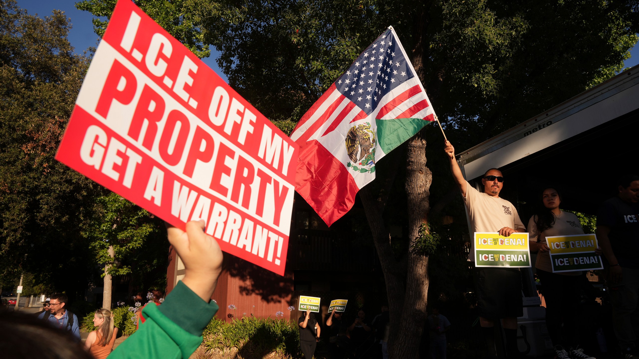 Residents gather during a community vigil on Monday, June 30, 2025, to stand in solidarity with an immigrant family after ICE agents detained Rosalina Luna Vargas on Saturday, June 28, in front of her children, in Pasadena, Calif. (AP Photo/Damian Dovarganes)