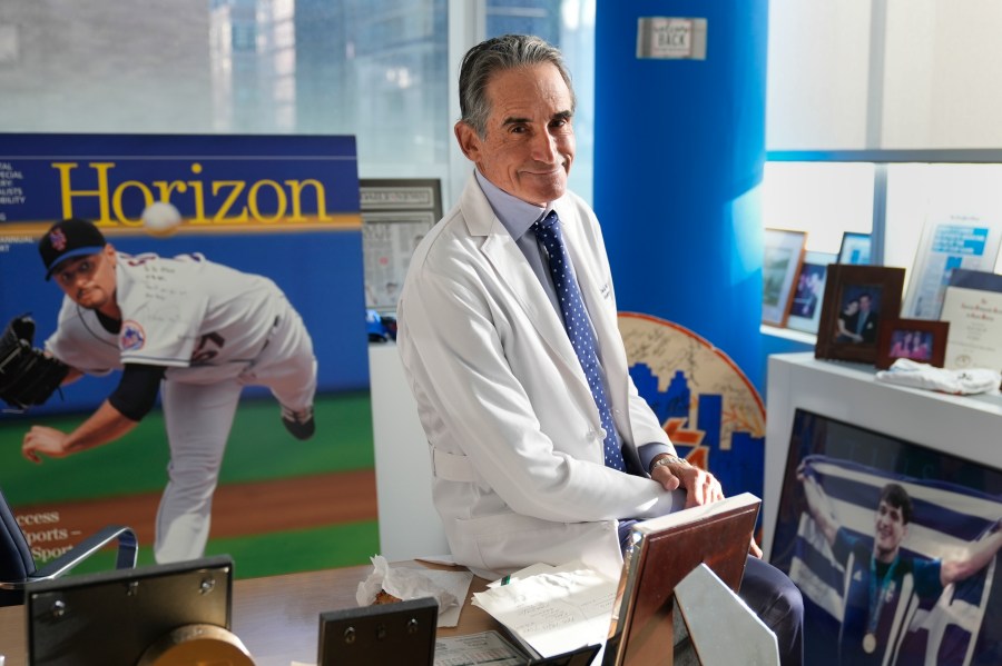 Dr. David Altchek poses in his office filled with sports memorabilia in New York, Thursday, Feb. 29, 2024. (AP Photo/Seth Wenig, File)