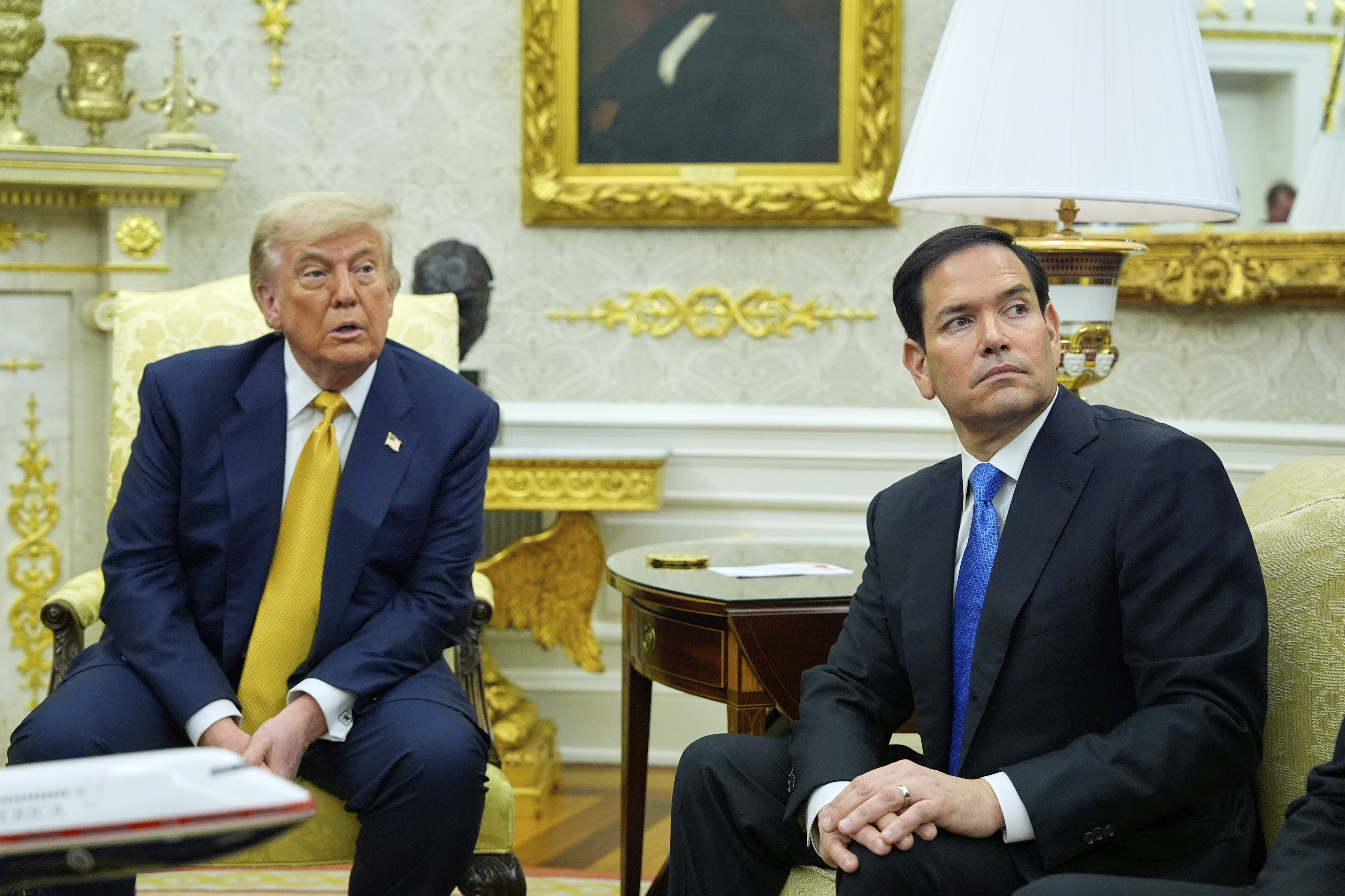 President Donald Trump and Secretary of State Marco Rubio listen during a meeting with Bahrain's Crown Prince Salman bin Hamad Al Khalifa in the Oval Office of the White House, Wednesday, July 16, 2025, in Washington. (AP Photo/Alex Brandon)