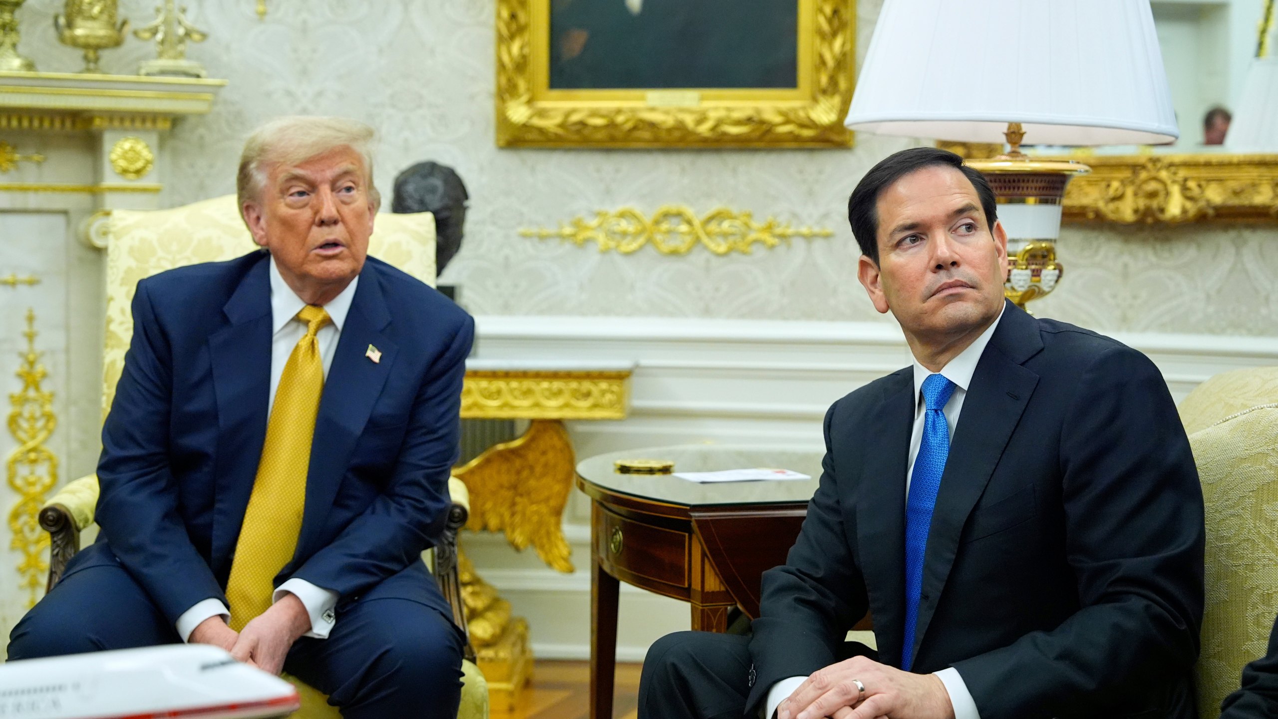 President Donald Trump and Secretary of State Marco Rubio listen during a meeting with Bahrain's Crown Prince Salman bin Hamad Al Khalifa in the Oval Office of the White House, Wednesday, July 16, 2025, in Washington. (AP Photo/Alex Brandon)