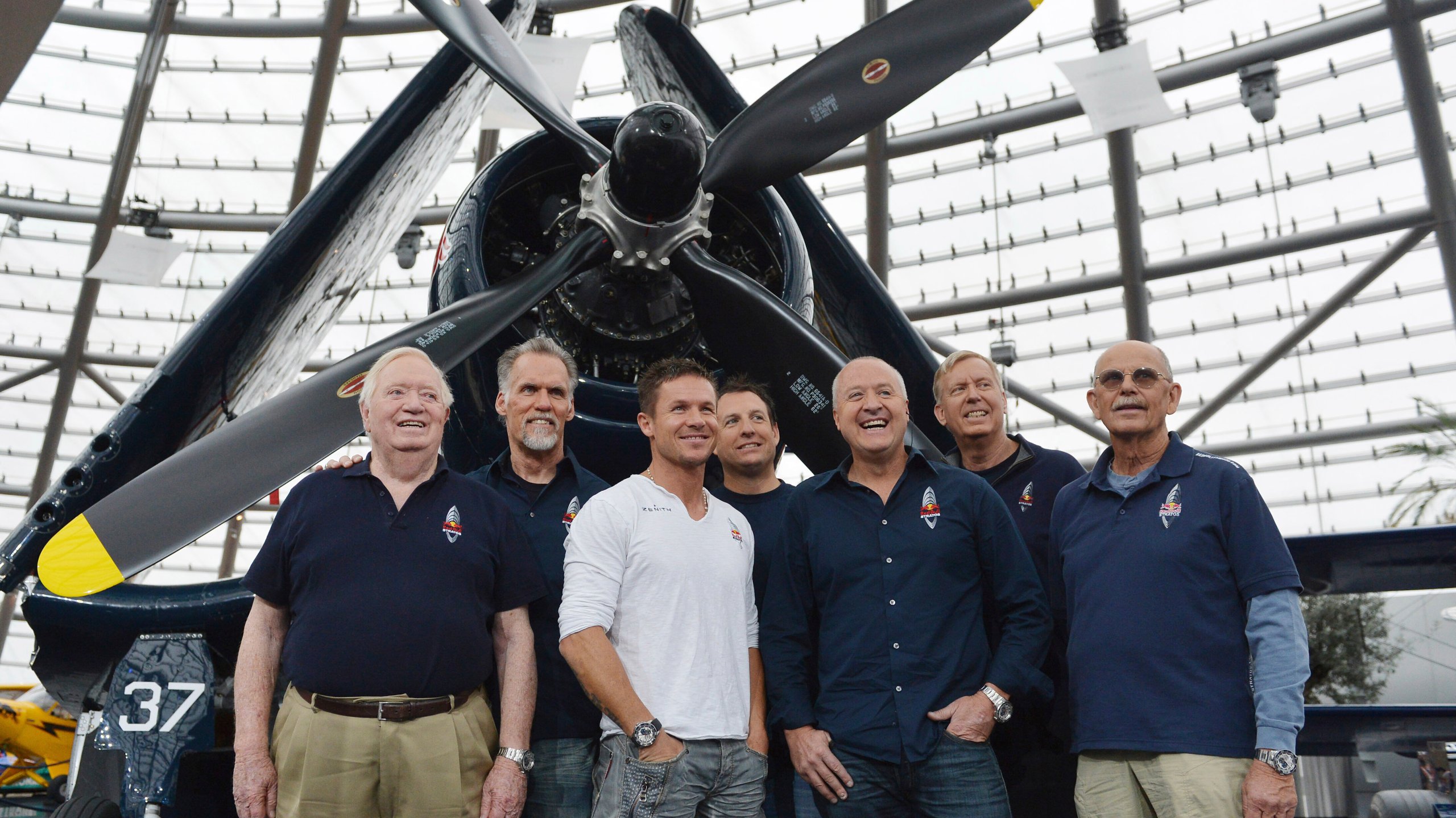 FILE - The Red Bull Stratos team from left: Col. Joe Kittinger, Art Thompson, Felix Baumgartner, Luke Aikins, Andy Walsh, Jon Clark and Mike Todd pose for photographers after a press conference in Salzburg, Austria, Oct. 27, 2012. (AP Photo/Kerstin Joensson, File)
