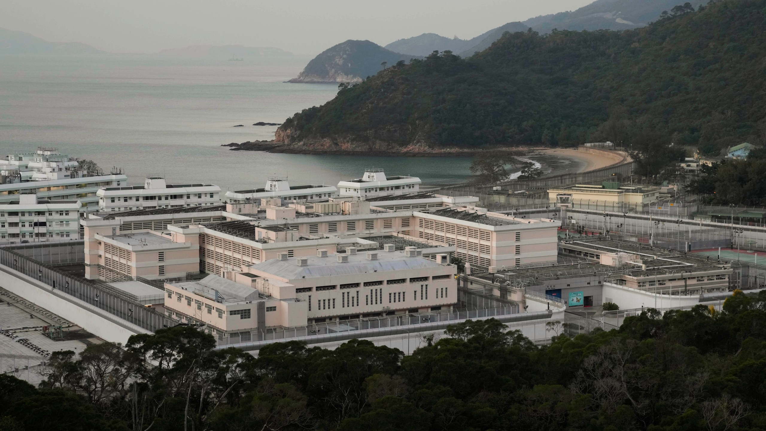 FILE -Exterior view of Shek Pik Prison is seen in Hong Kong, Jan. 19, 2022. (AP Photo/Kin Cheung), File)