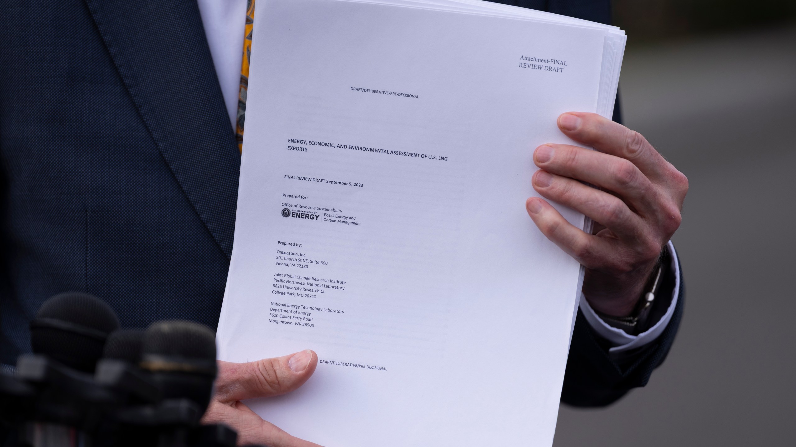 FILEL - Energy Secretary Chris Wright holds a report concerning U.S. exports of liquefied natural gas (LNG) as he speaks to reporters at the White House in Washington, on March 19, 2025. (AP Photo/Ben Curtis, File)