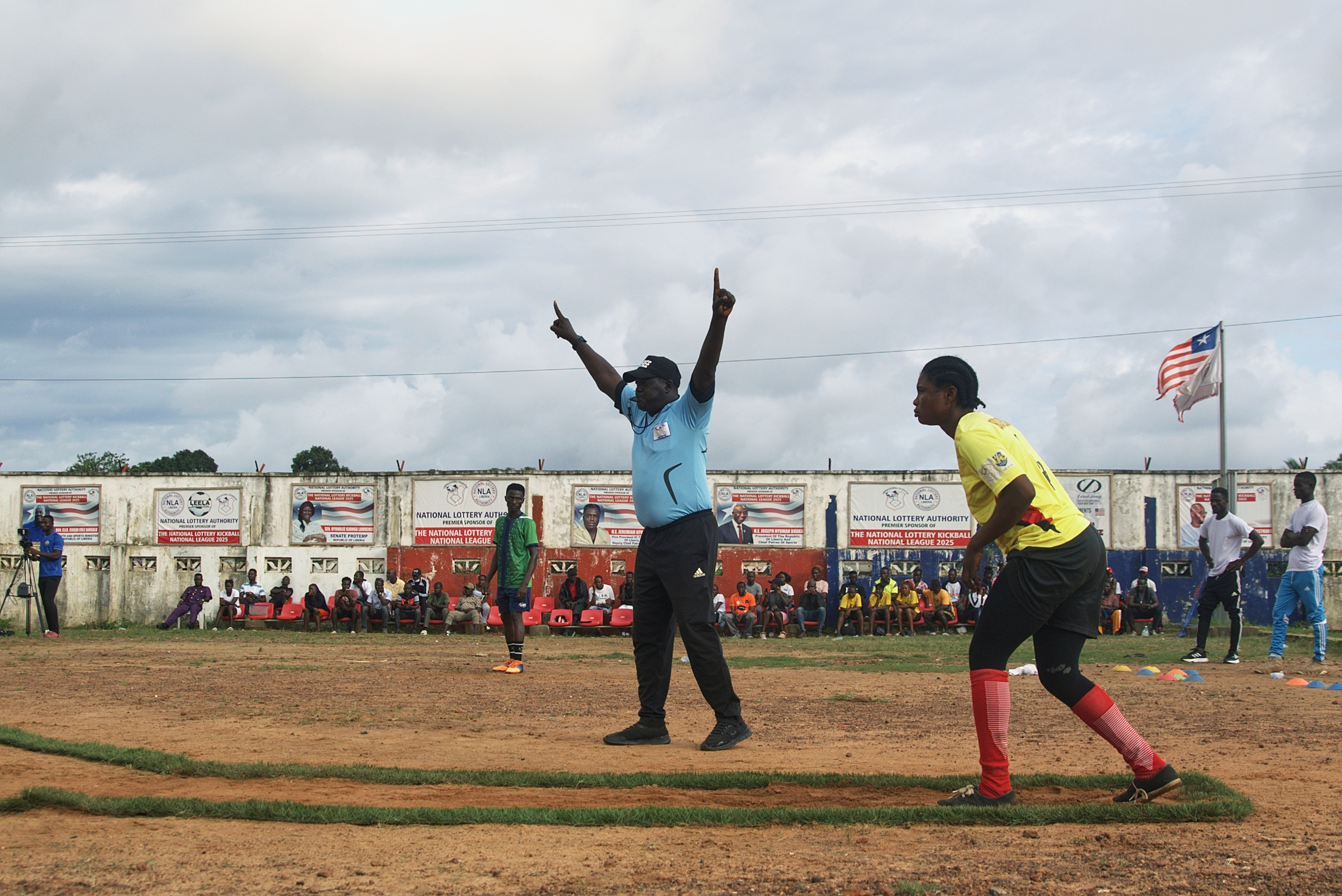 A kickball player prepares to kick the ball during a match at the Samuel Kanyon Doe Stadium in Monrovia, Liberia, June 14, 2025. (AP Photo/Annie Risemberg)