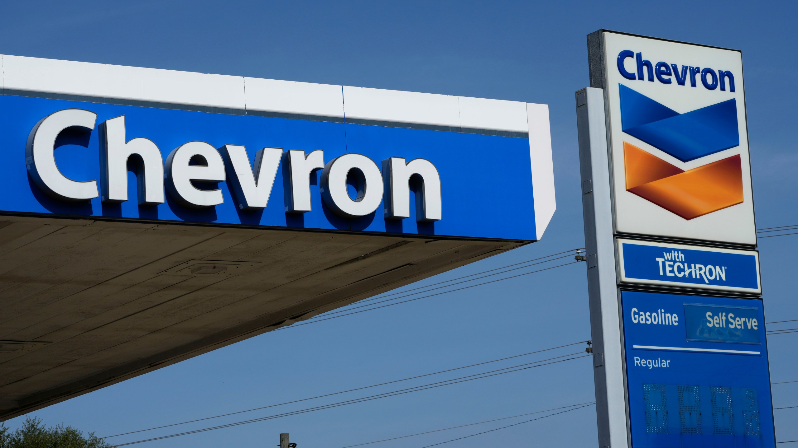 File - Chevron logos are displayed at a gas station in Columbus, Miss., Monday, Oct. 23, 2023.(AP Photo/Rogelio V. Solis, File)