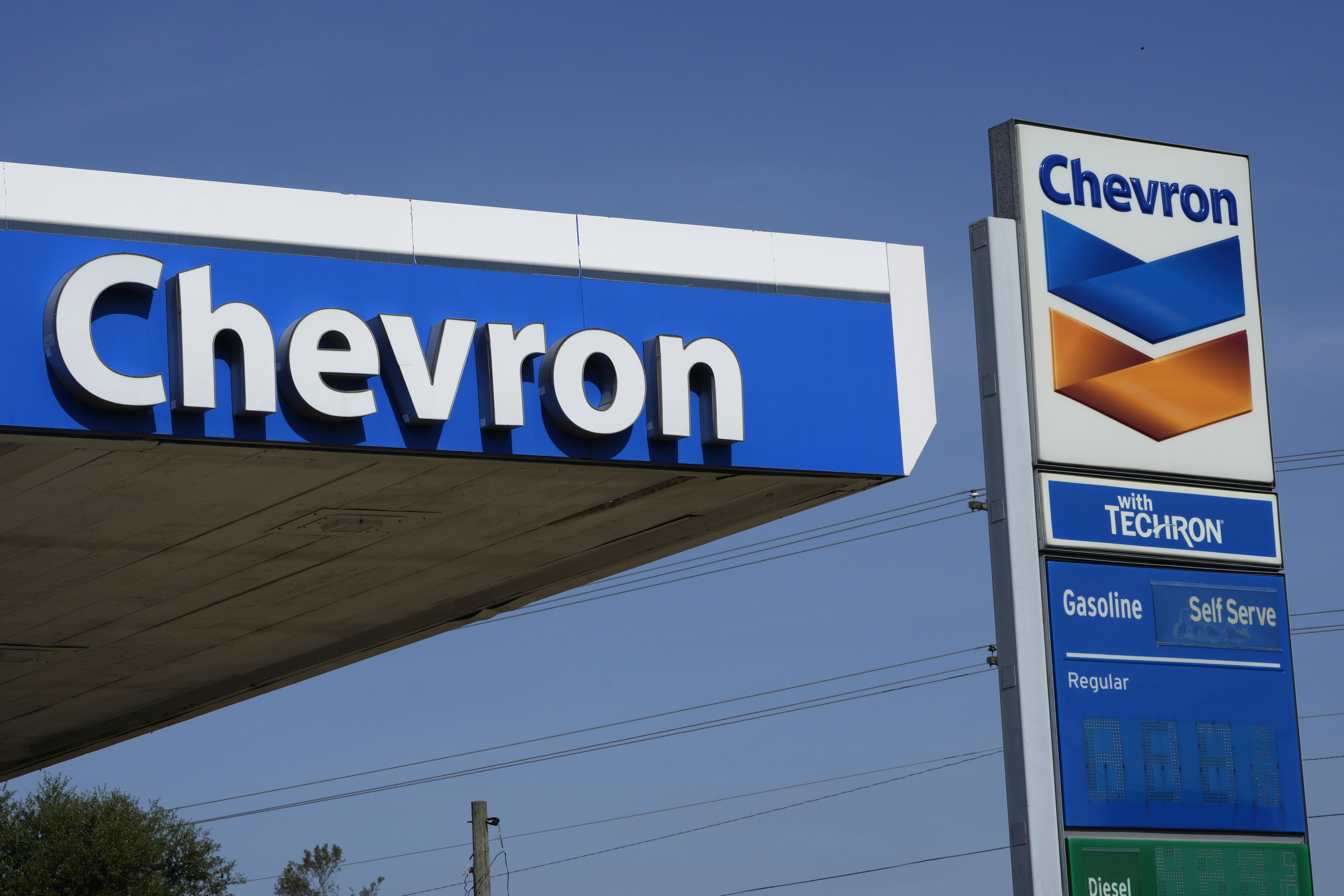 File - Chevron logos are displayed at a gas station in Columbus, Miss., Monday, Oct. 23, 2023.(AP Photo/Rogelio V. Solis, File)