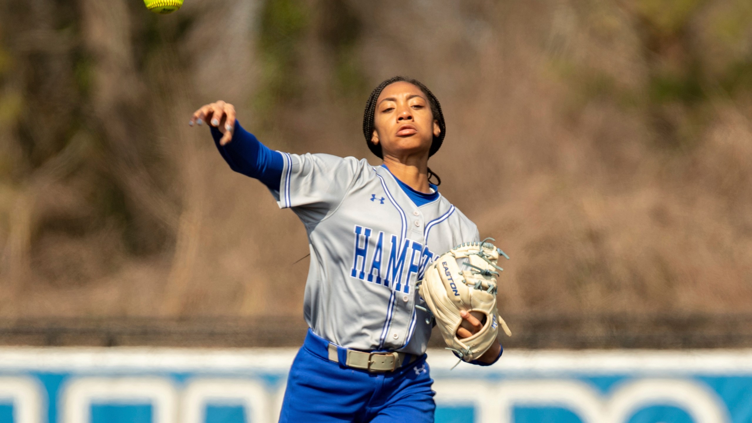 FILE - Hampton infielder Mo'ne Davis (3) fields a ground ball and throws to first base during an NCAA softball game on Sunday, March 6, 2022 in Hampton, Va. (AP Photo/Mike Caudill, File)