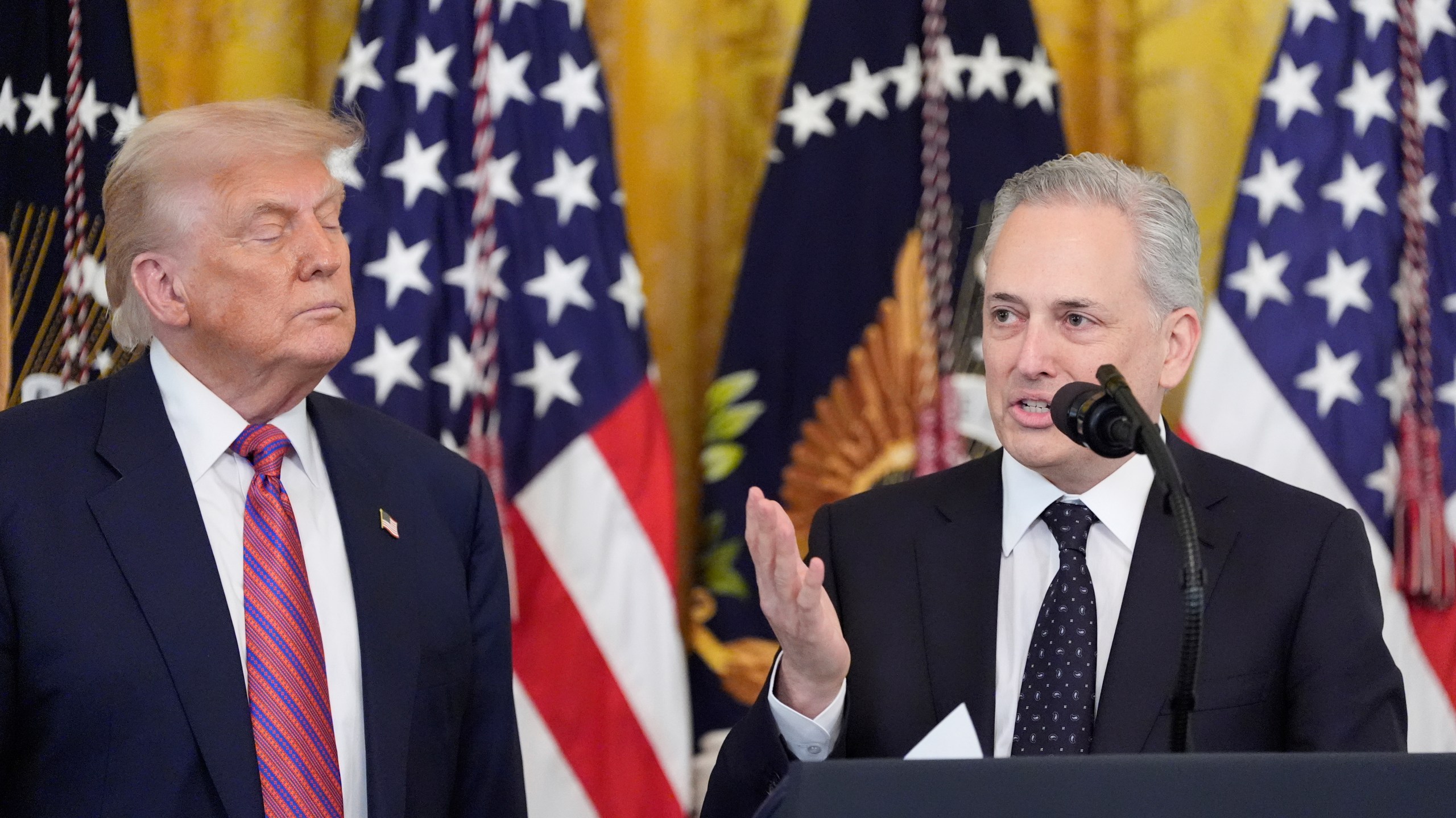White House AI and crypto czar David Sacks speaks as President Donald Trump listens at an event for the signing of the GENIUS Act, a bill that regulates stablecoins, a type of cryptocurrency, in the East Room of the White House, Friday, July 18, 2025, in Washington. (AP Photo/Alex Brandon)