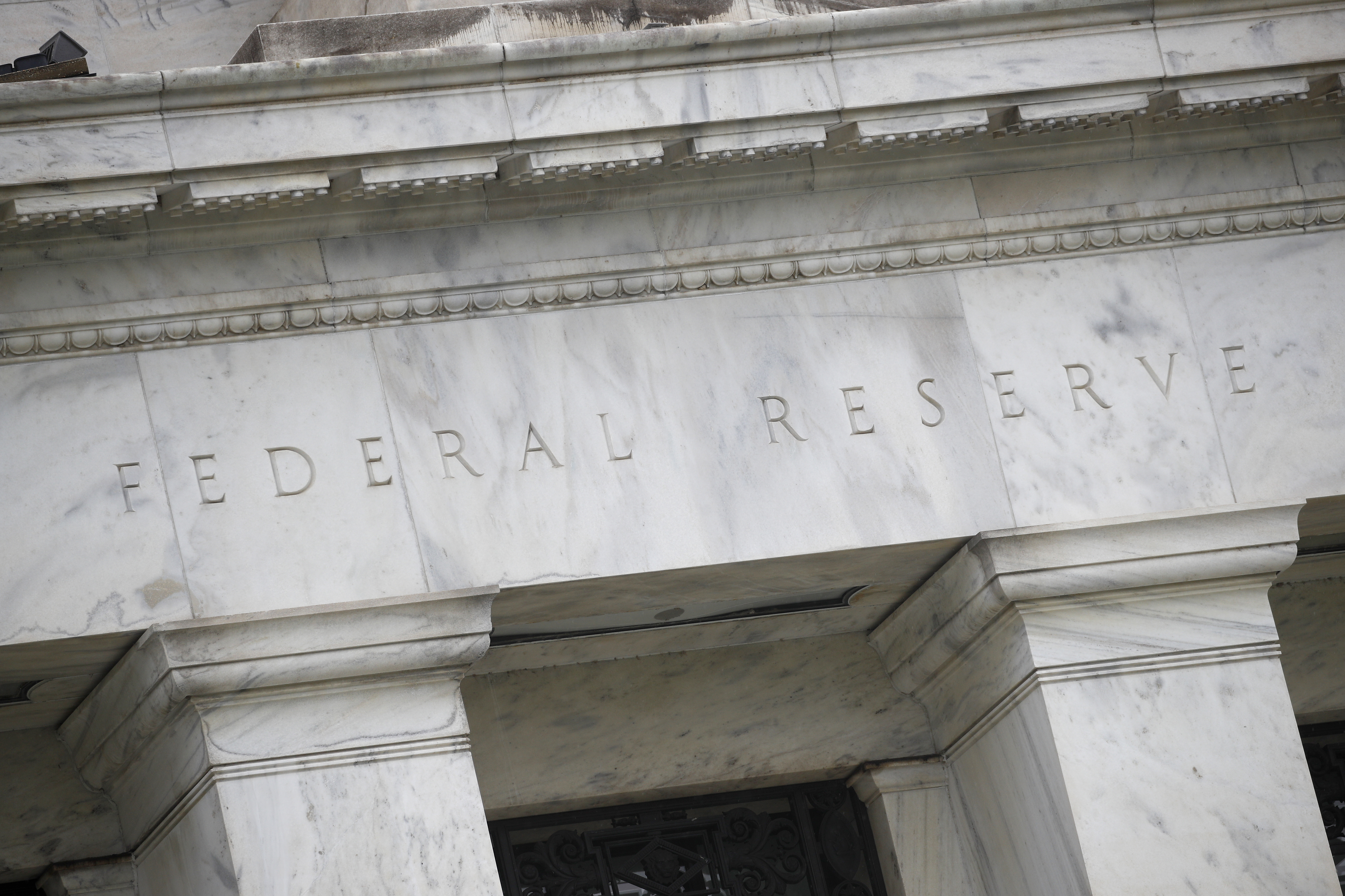 FILE - The Federal Reserve building in seen in Washington, May 22, 2020. (AP Photo/Patrick Semansky, File)