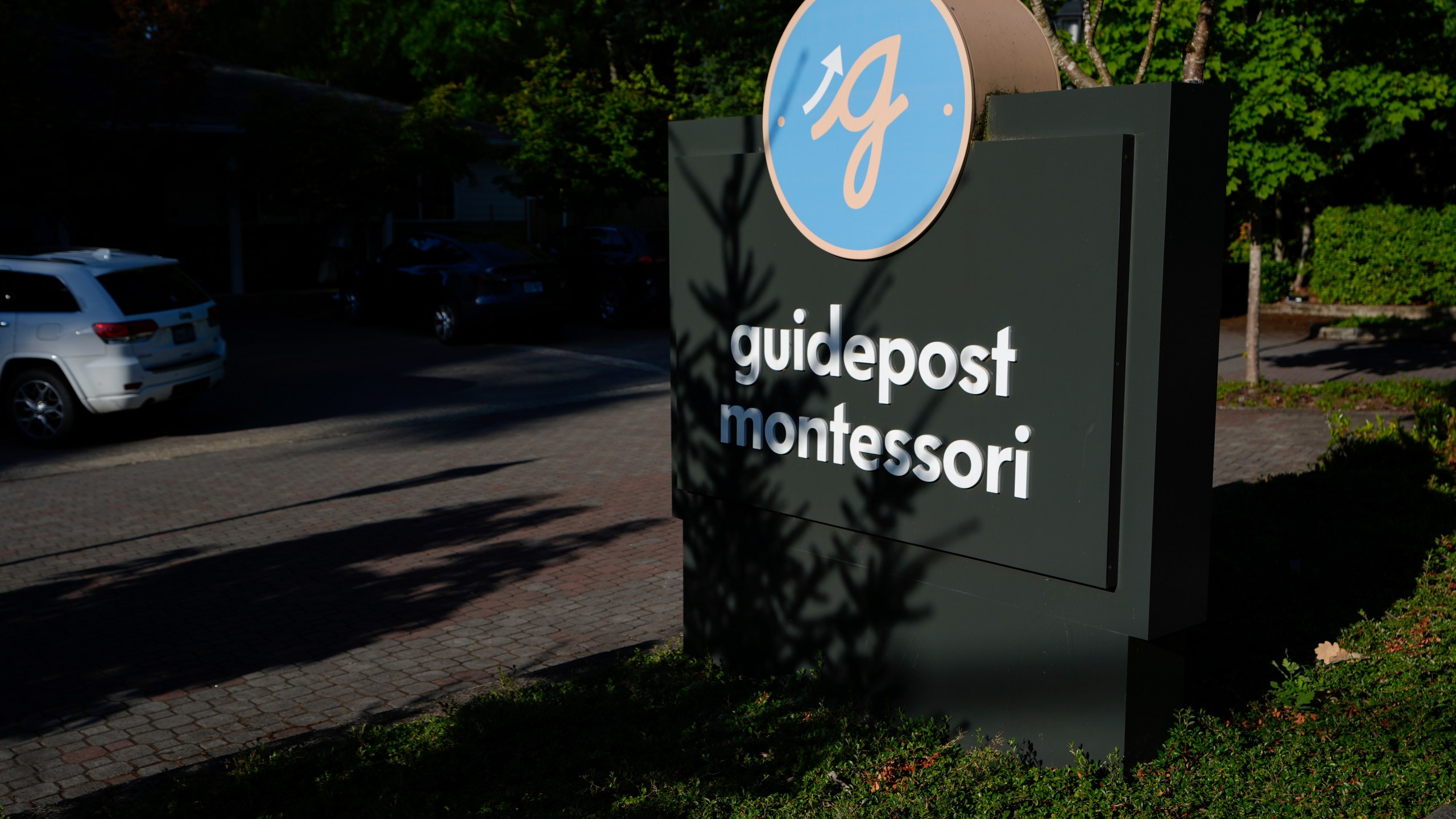 A sign for the Guidepost Montessori school is seen Friday, July 18, 2025, in Beaverton, Ore. (AP Photo/Jenny Kane)