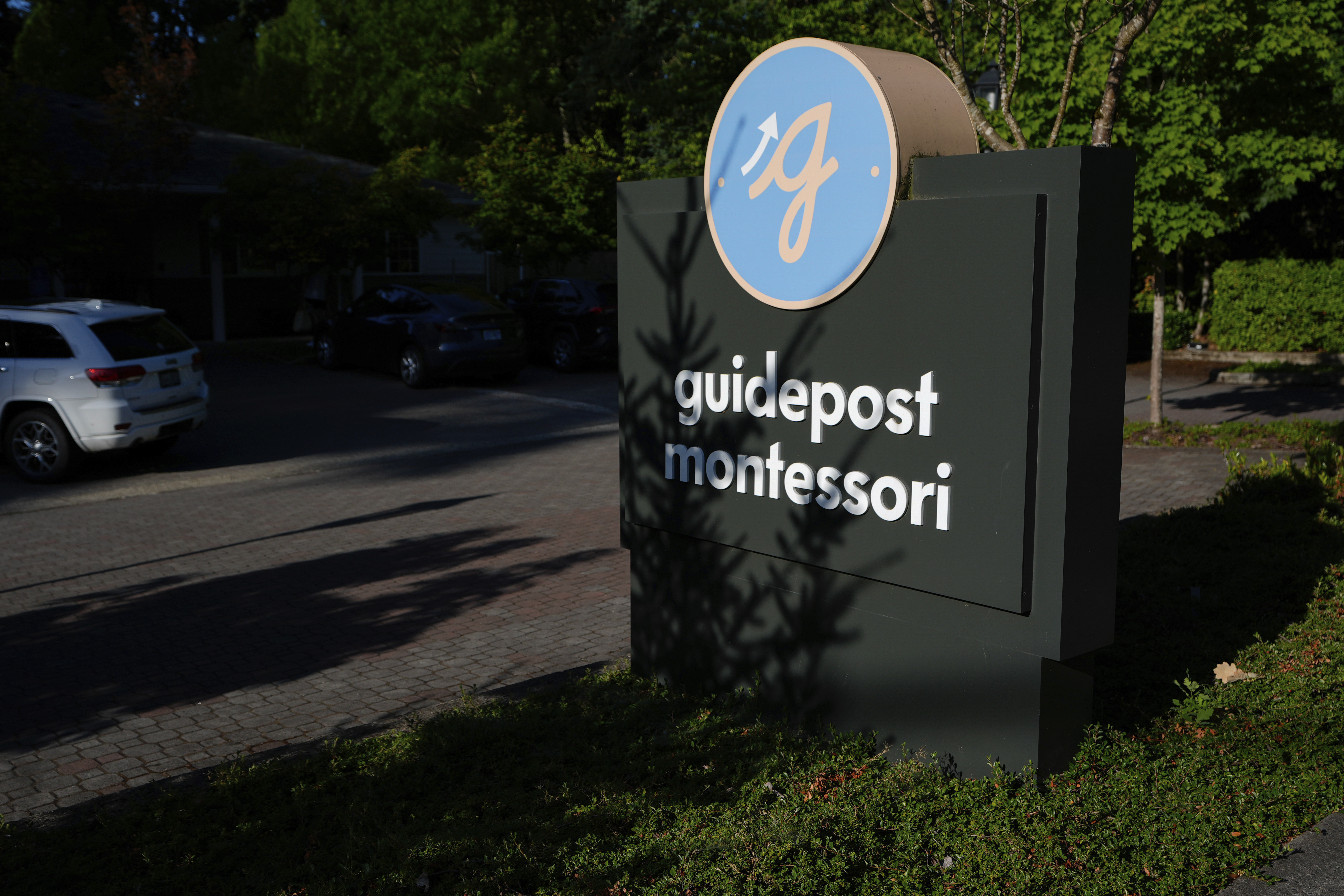 A sign for the Guidepost Montessori school is seen Friday, July 18, 2025, in Beaverton, Ore. (AP Photo/Jenny Kane)
