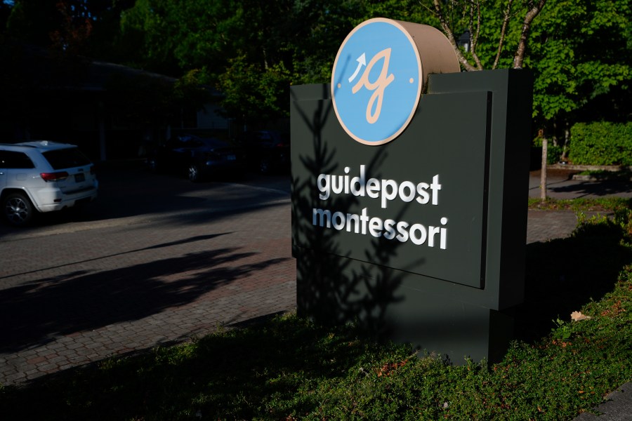 A sign for the Guidepost Montessori school is seen Friday, July 18, 2025, in Beaverton, Ore. (AP Photo/Jenny Kane)