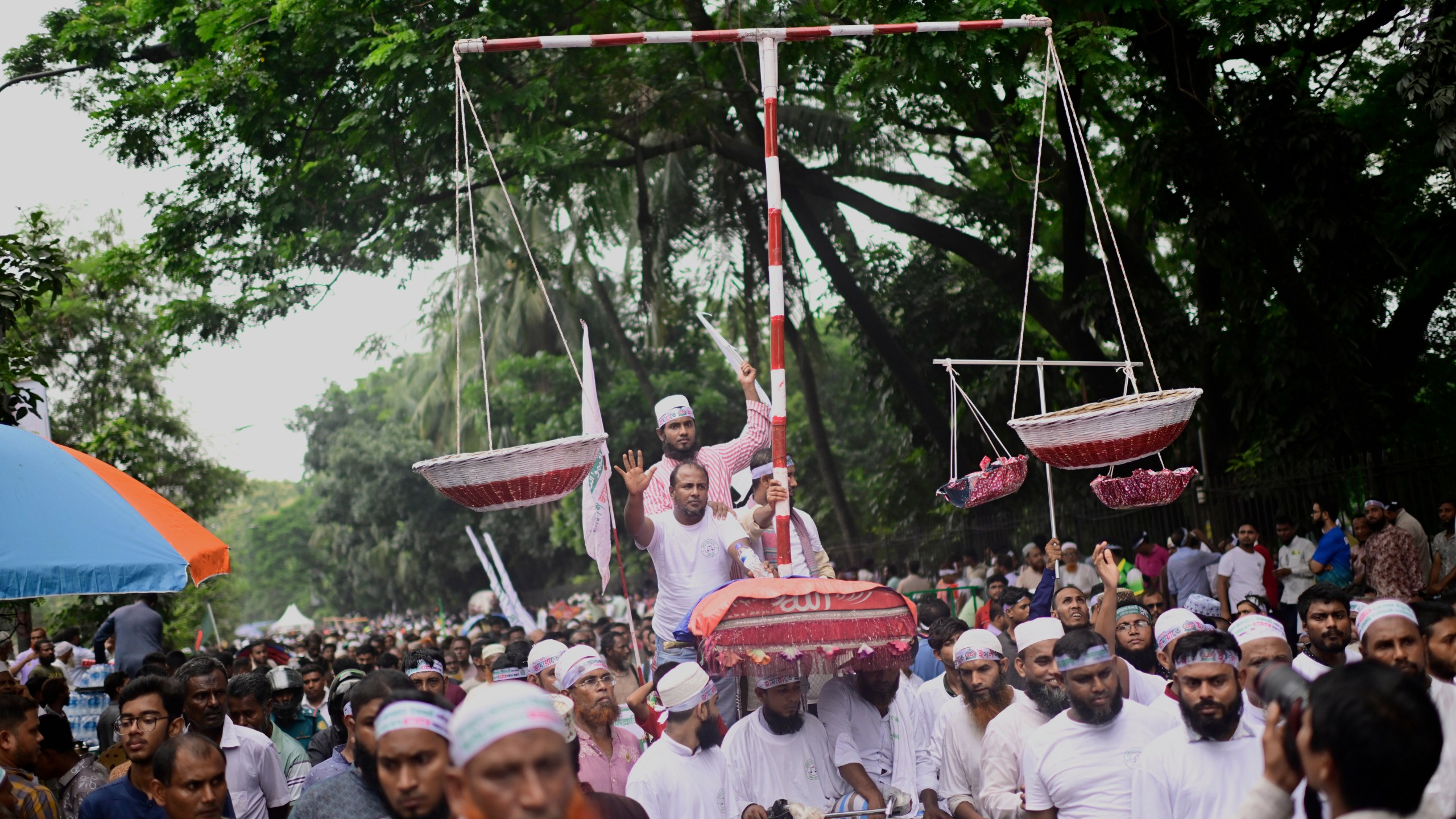 Thousands of supporters of Bangladesh's largest Islamist party Jamaat-e-Islami turn out at a rally in a show of strength ahead of elections expected next year, in Dhaka, Bangladesh, Saturday, July 19, 2025. (AP Photo/Mahmud Hossain Opu)