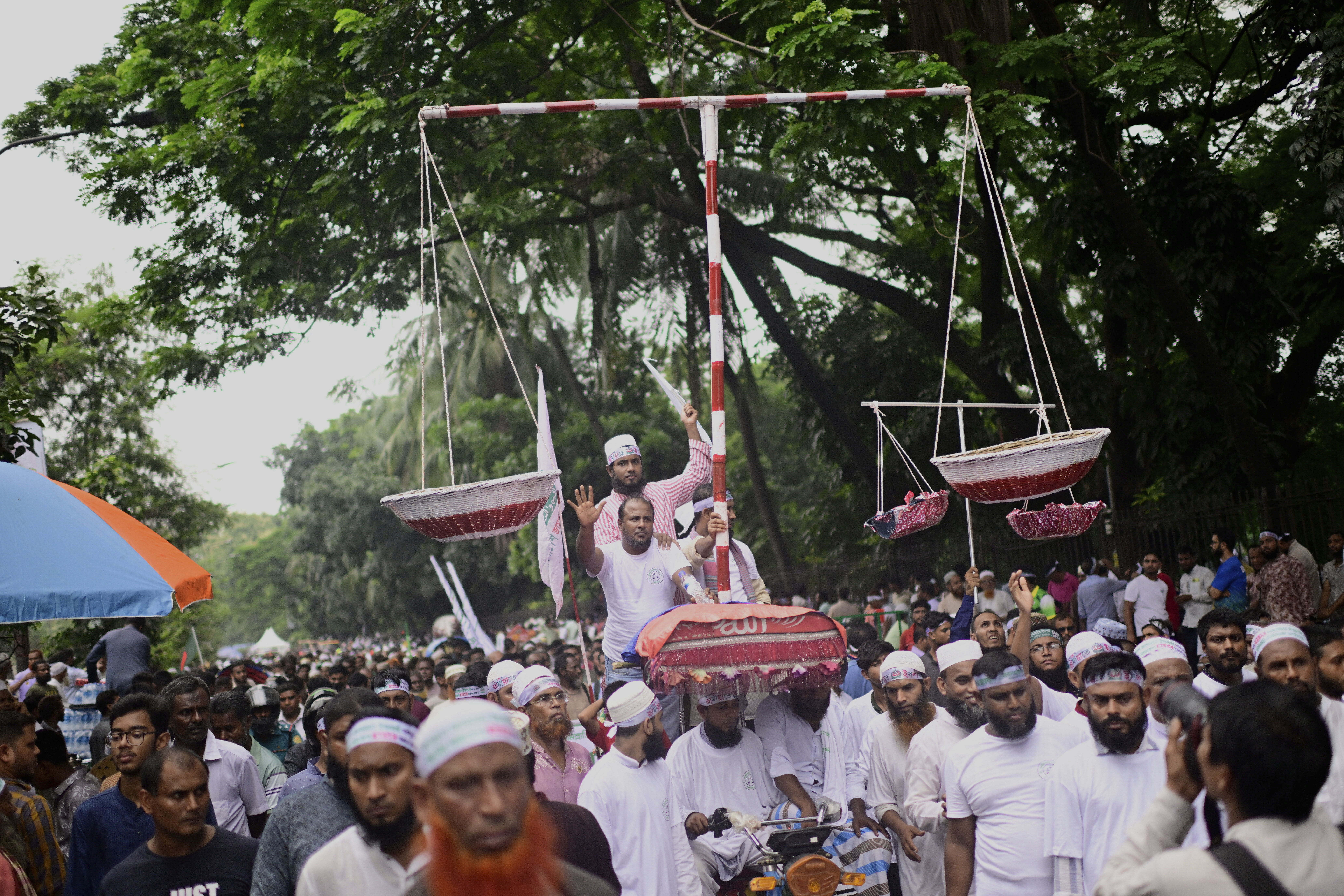 Thousands of supporters of Bangladesh's largest Islamist party Jamaat-e-Islami turn out at a rally in a show of strength ahead of elections expected next year, in Dhaka, Bangladesh, Saturday, July 19, 2025. (AP Photo/Mahmud Hossain Opu)