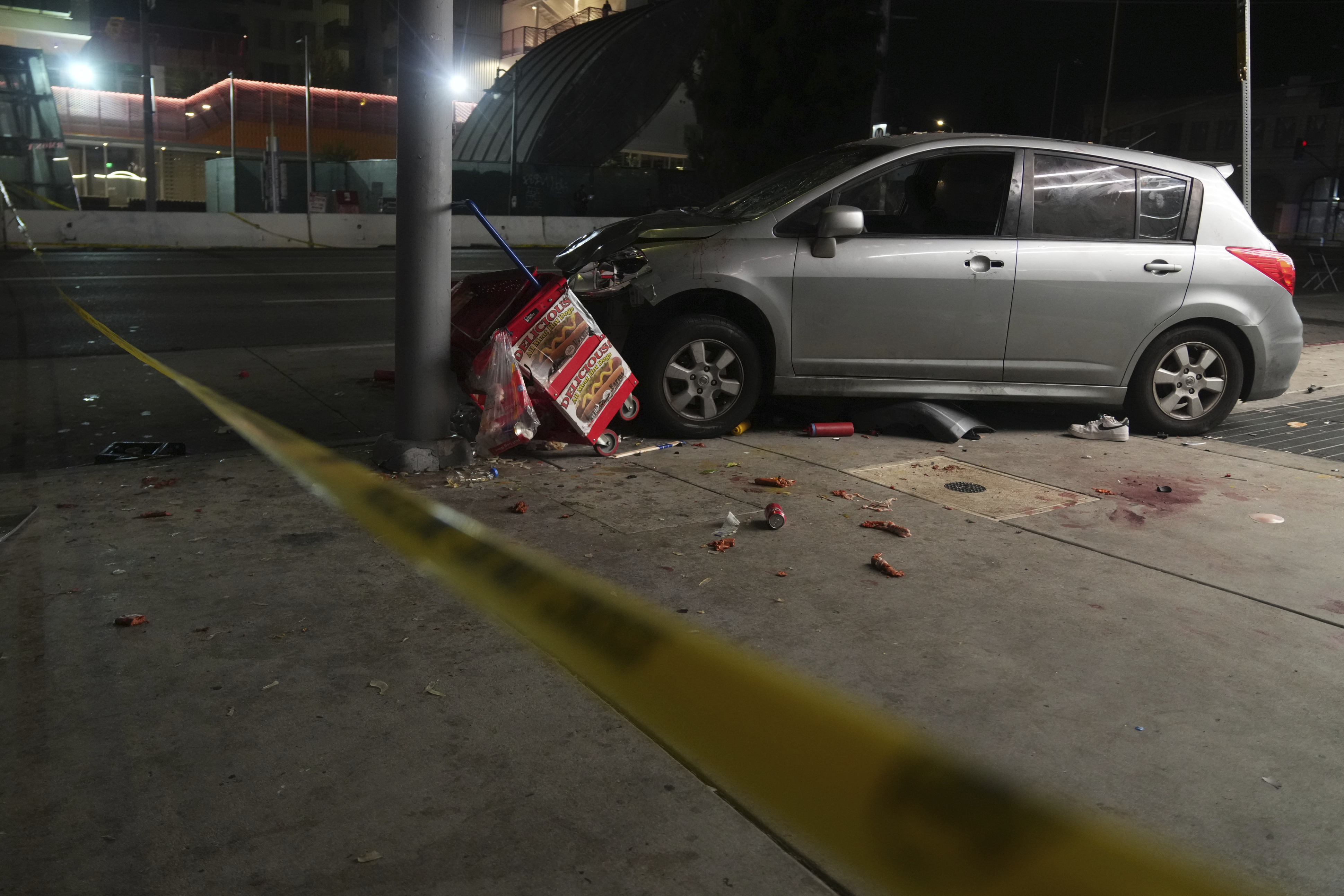 An area is roped off after a vehicle rammed into a crowd of people waiting to enter a nightclub along a busy boulevard in Los Angeles early Saturday, July 19, 2025, injuring several people. (AP Photo/Damian Dovarganes)