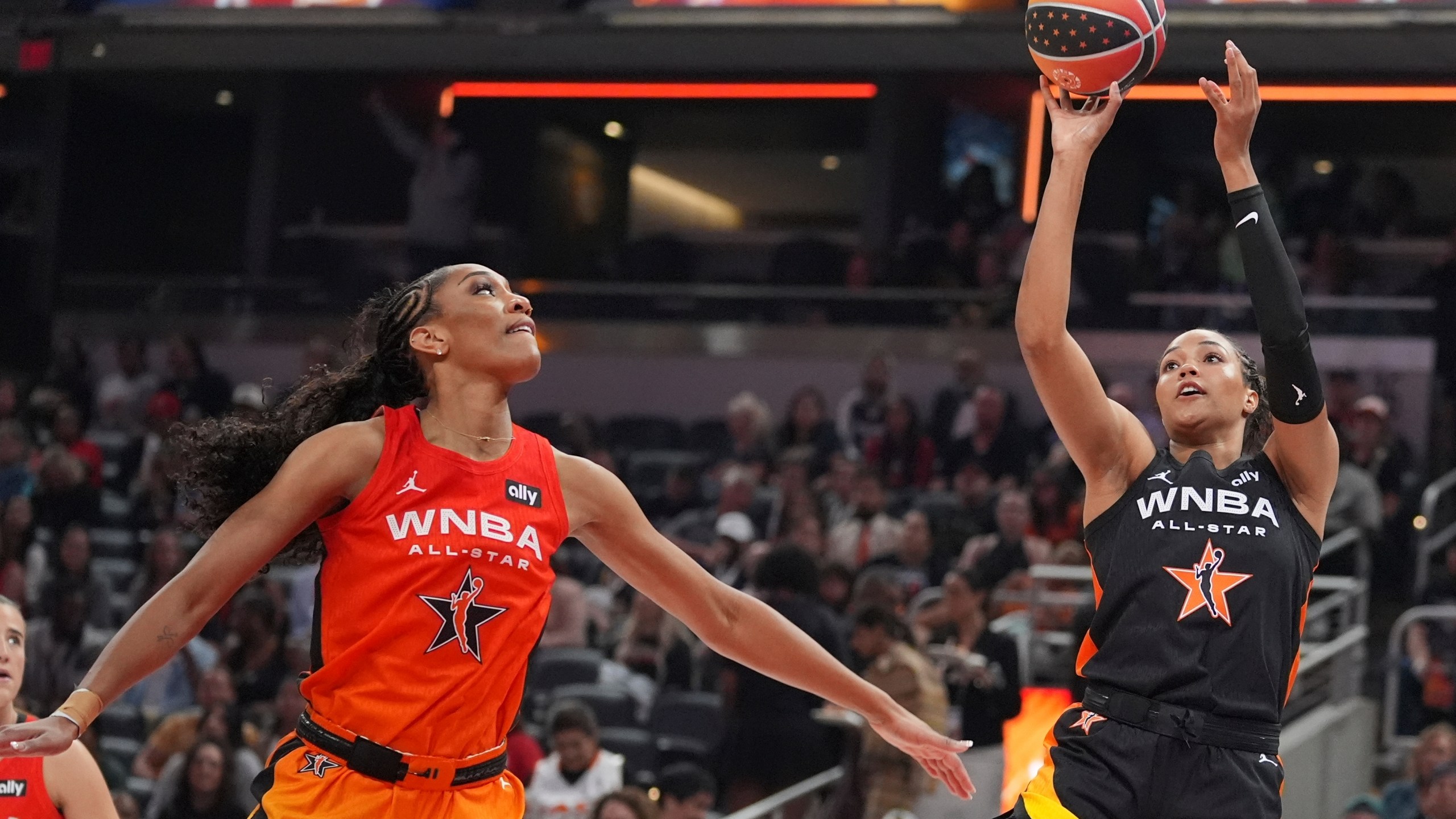 Minnesota Lynx's Napheesa Collier, right, shoots against Las Vegas Aces' A'ja Wilson during the second half of a WNBA All-Star basketball game, Saturday, July 19, 2025, in Indianapolis. (AP Photo/Michael Conroy)