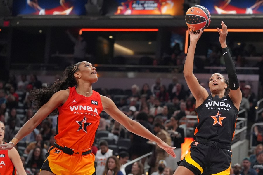 Minnesota Lynx's Napheesa Collier, right, shoots against Las Vegas Aces' A'ja Wilson during the second half of a WNBA All-Star basketball game, Saturday, July 19, 2025, in Indianapolis. (AP Photo/Michael Conroy)