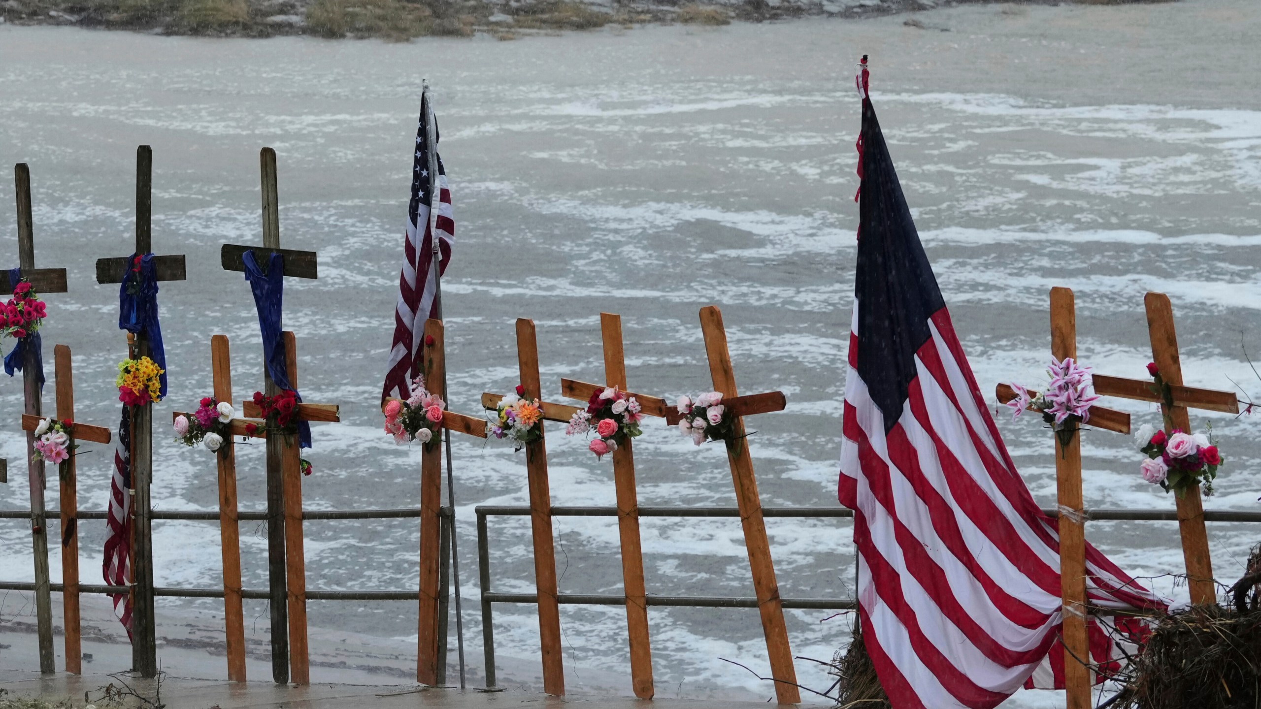FILE - Rain falls over a makeshift memorial for flood victims along the Guadalupe River, Sunday, July 13, 2025, in Kerrville, Texas. (AP Photo/Eric Gay, File)