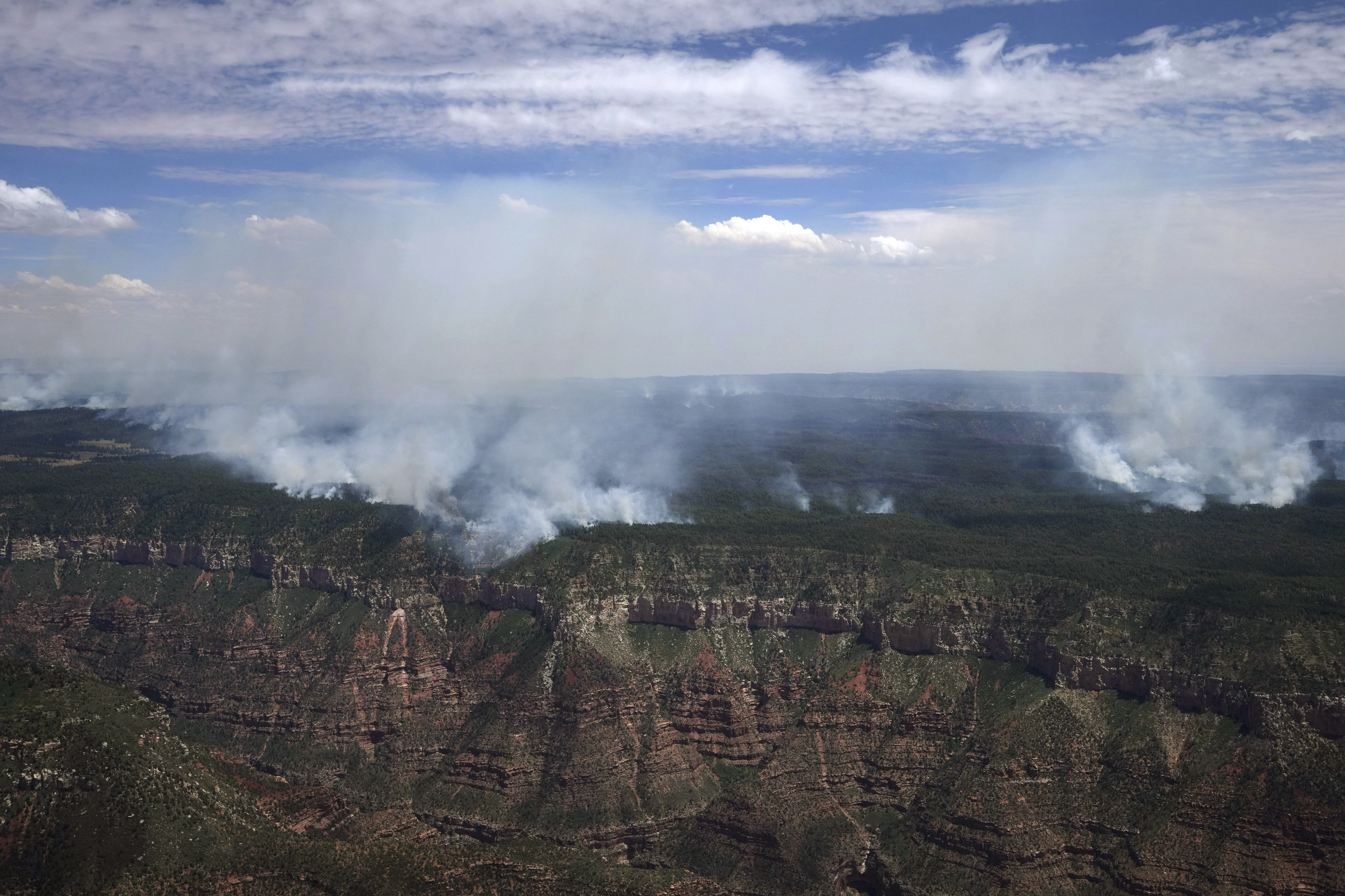The Dragon Bravo Fire continues to burn on the Grand Canyon's north rim Saturday, July 19, 2025. (Joe Rondone/The Arizona Republic via AP, Pool)