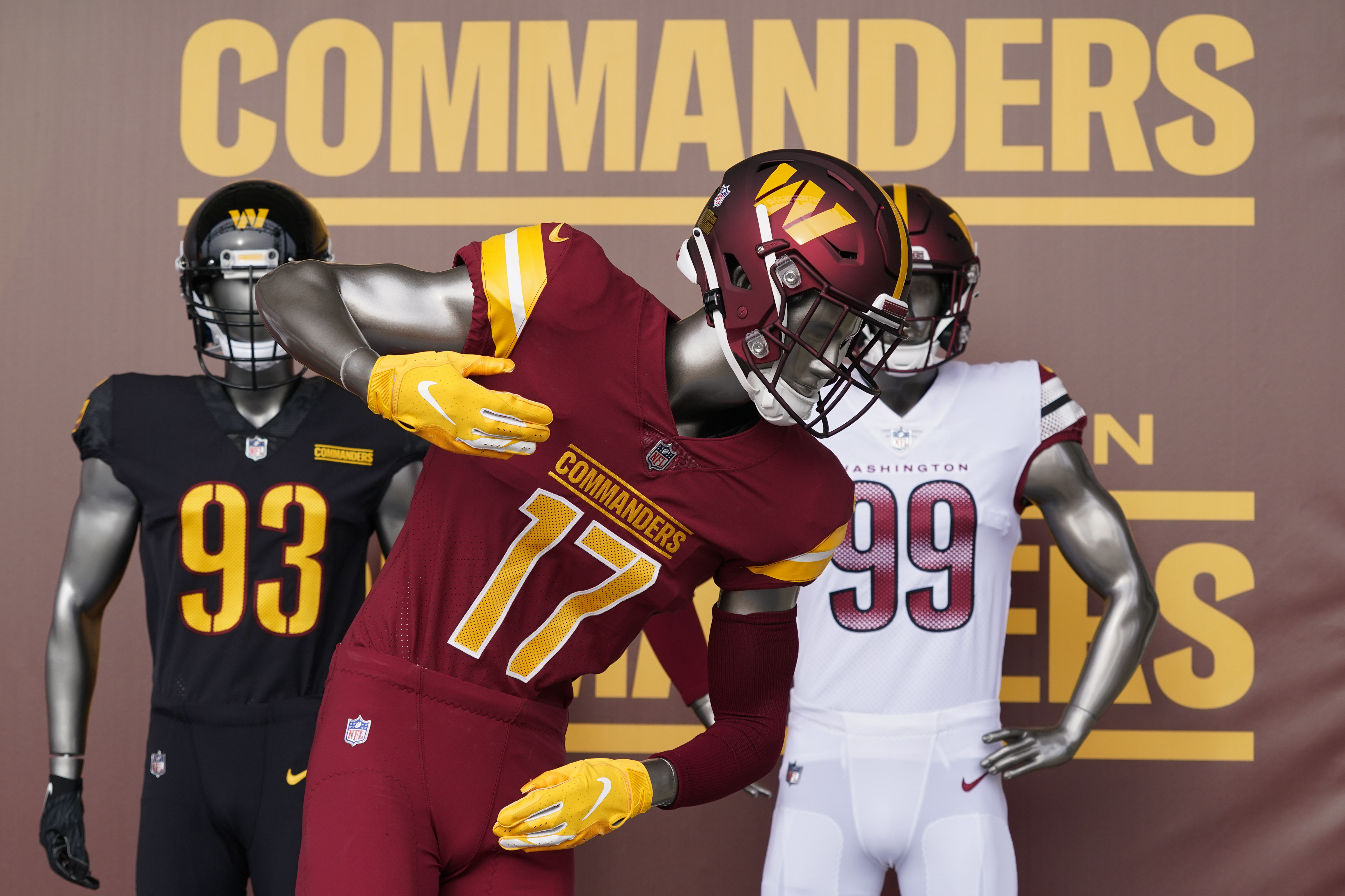 FILE - Washington Commanders jerseys are displayed at an event to unveil the NFL football team's new identity, Feb. 2, 2022, in Landover, Md. (AP Photo/Patrick Semansky, file)