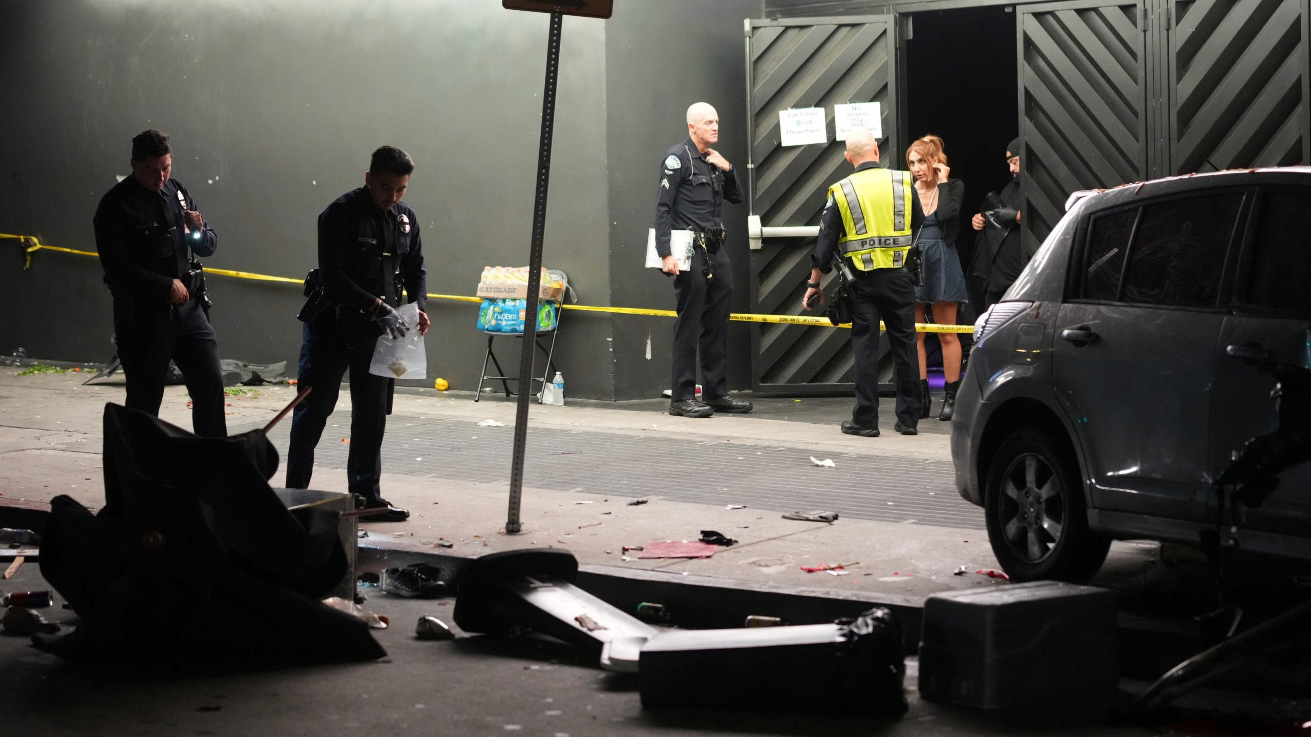 Law enforcement investigate the scene where a vehicle rammed into a crowd of people waiting to enter a nightclub along a busy boulevard in Los Angeles early Saturday, July 19, 2025 injuring several people. (AP Photo/Damian Dovarganes)