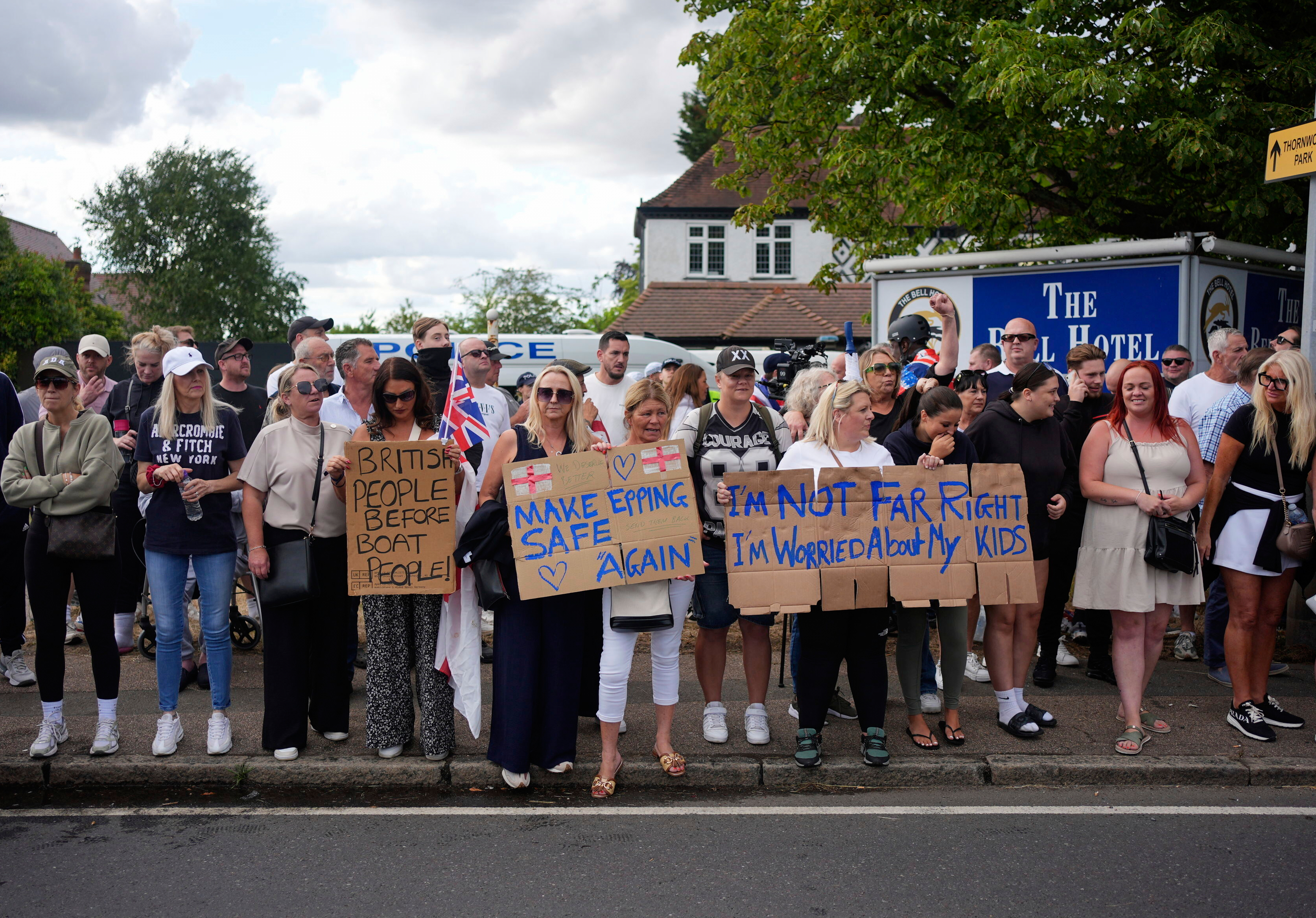 Protesters demonstrate outside the Bell Hotel in the town of Epping, Essex, England, Sunday, July 20, 2025. (Yui Mok/PA via AP)