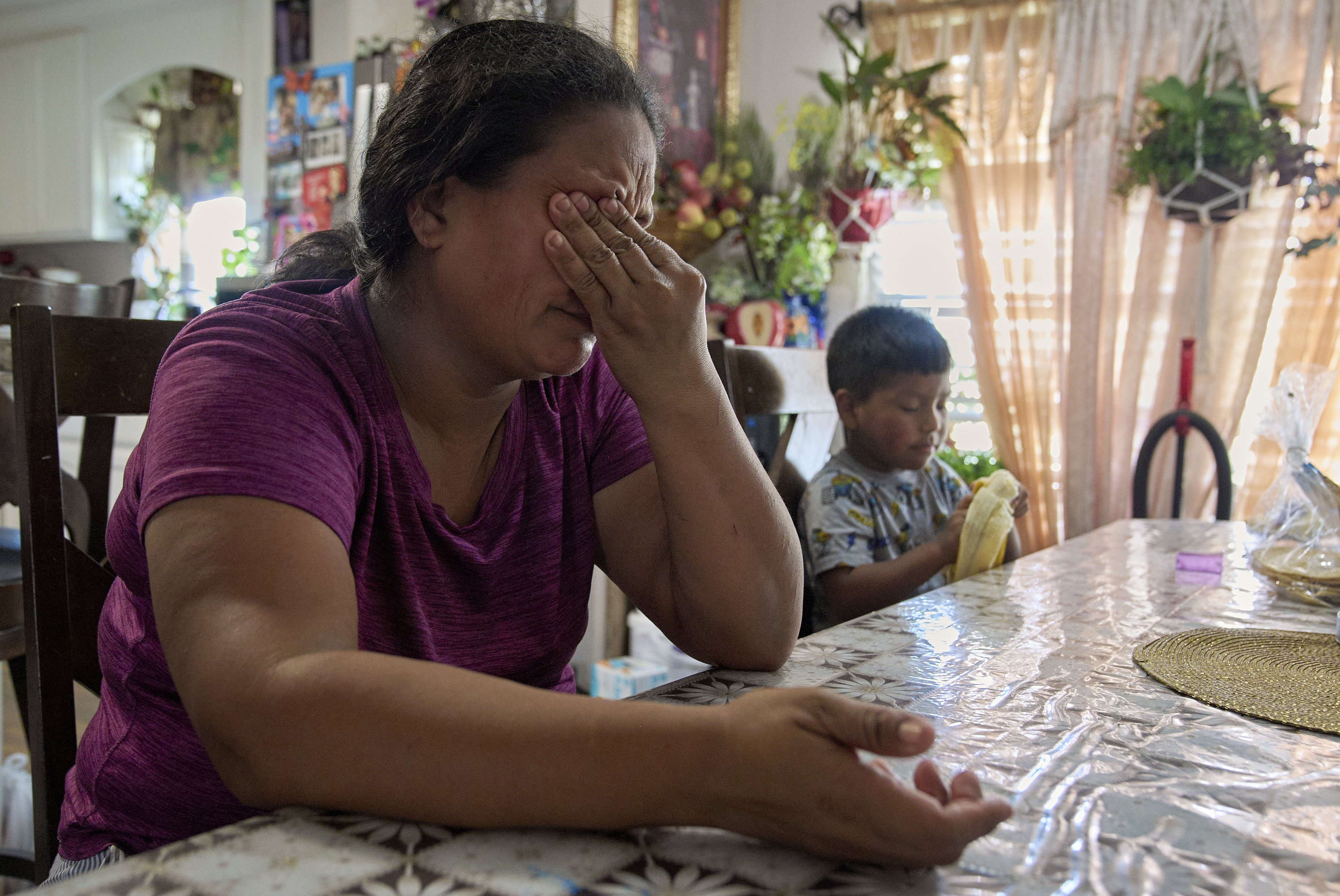Maria sobs as she recounts how scared and anxious she is for her children, including 4-year-old Juan, if she is taken away by ICE agents, Wednesday, June 18, 2025, while inside her home in Hidalgo County, Texas. (AP Photo/Jacquelyn Martin)