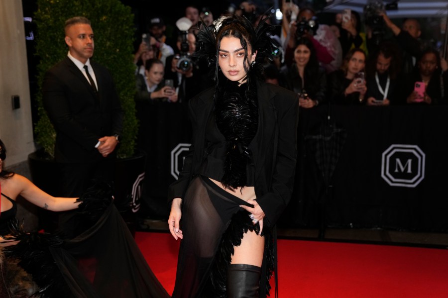 FILE - Charli xcx departs The Mark Hotel prior to attending The Metropolitan Museum of Art's Costume Institute benefit gala celebrating the opening of "Superfine: Tailoring Black Style" on Monday, May 5, 2025, in New York. (Photo by Charles Sykes/Invision/AP, file)