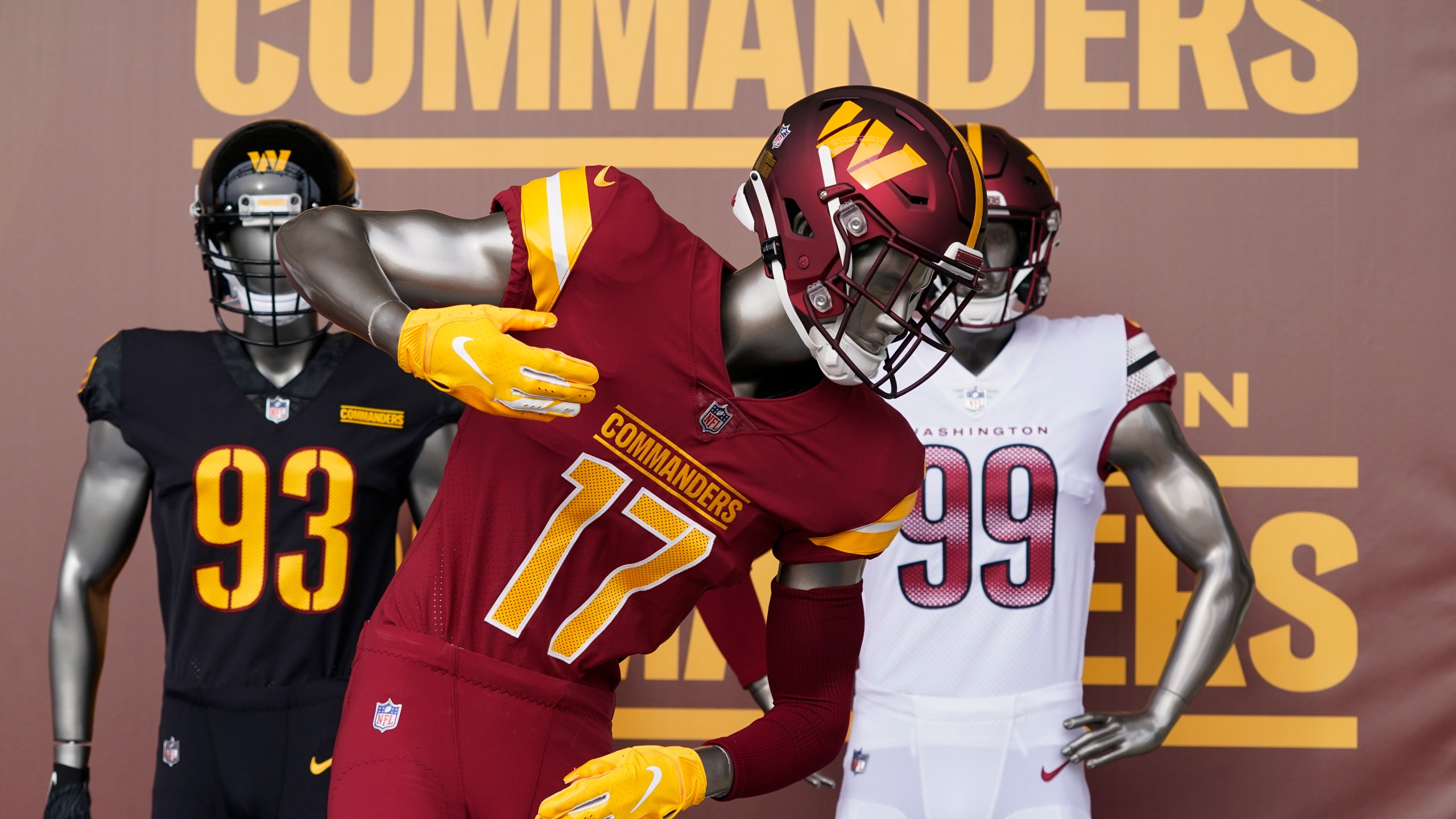 FILE - Washington Commanders jerseys are displayed at an event to unveil the NFL football team's new identity, Feb. 2, 2022, in Landover, Md. (AP Photo/Patrick Semansky, file)