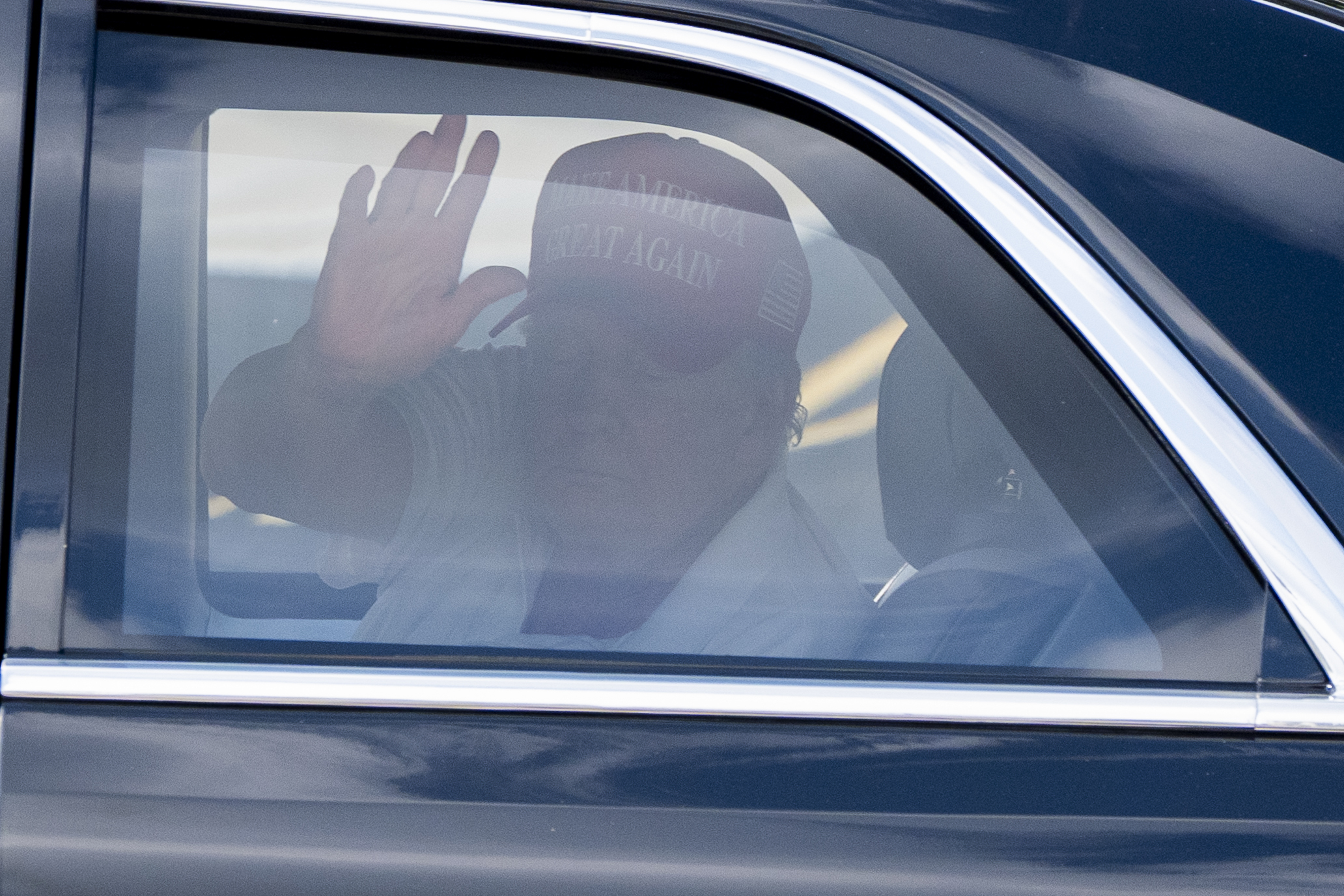 FILE - President Donald Trump waves as he departs in his motorcade from the Trump International Golf Club, March 1, 2025, in West Palm Beach, Fla. (AP Photo/Alex Brandon, File)