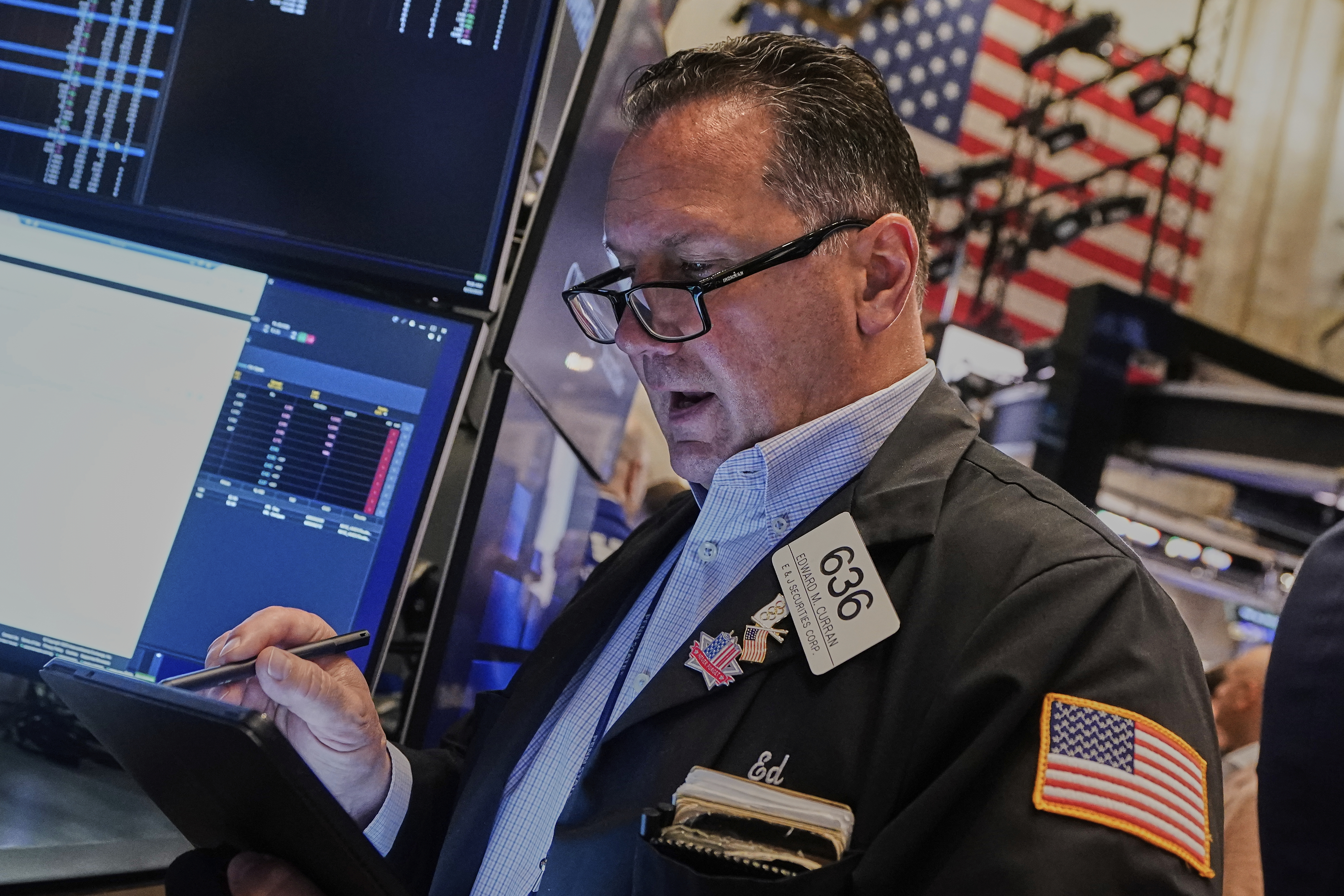Trader Edward Curran works on the floor of the New York Stock Exchange, Monday, June 23, 2025. (AP Photo/Richard Drew)