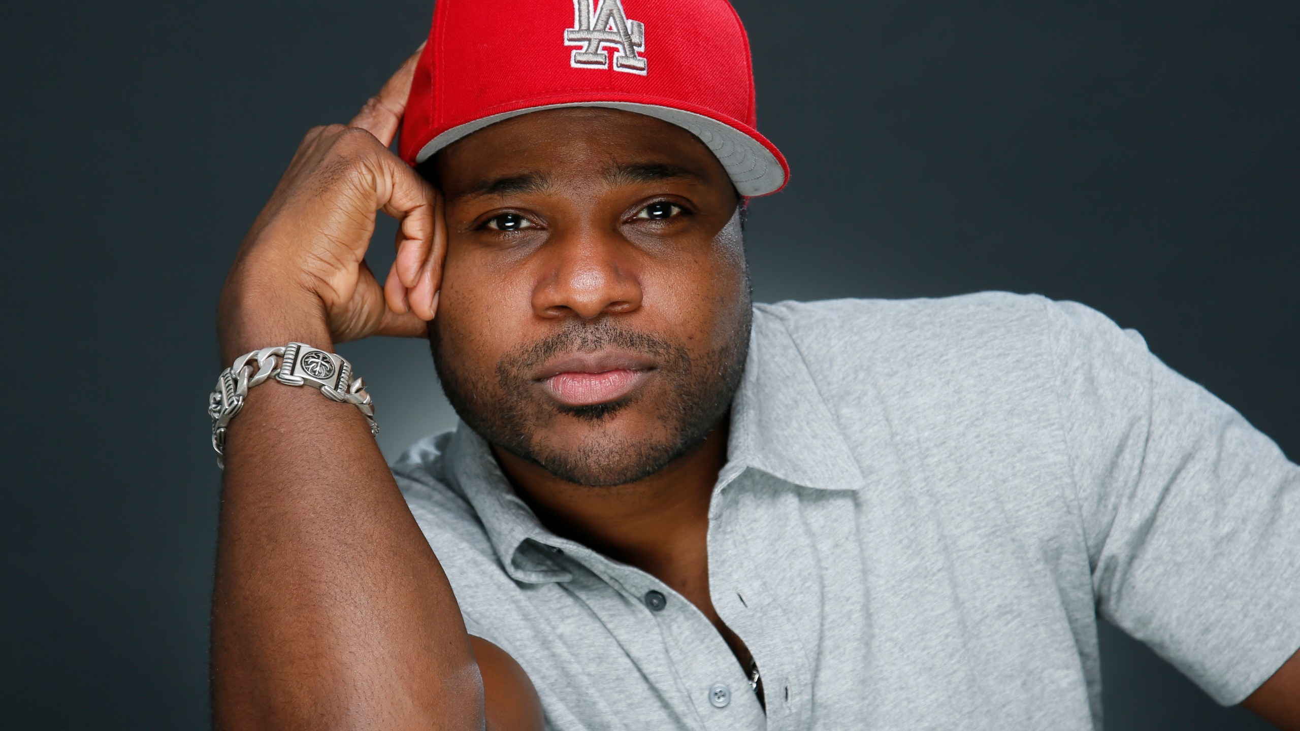 FILE - Actor and musician Malcolm-Jamal Warner poses for a portrait in Los Angeles, Oct. 8, 2015. (Photo by Danny Moloshok/Invision/AP, File)