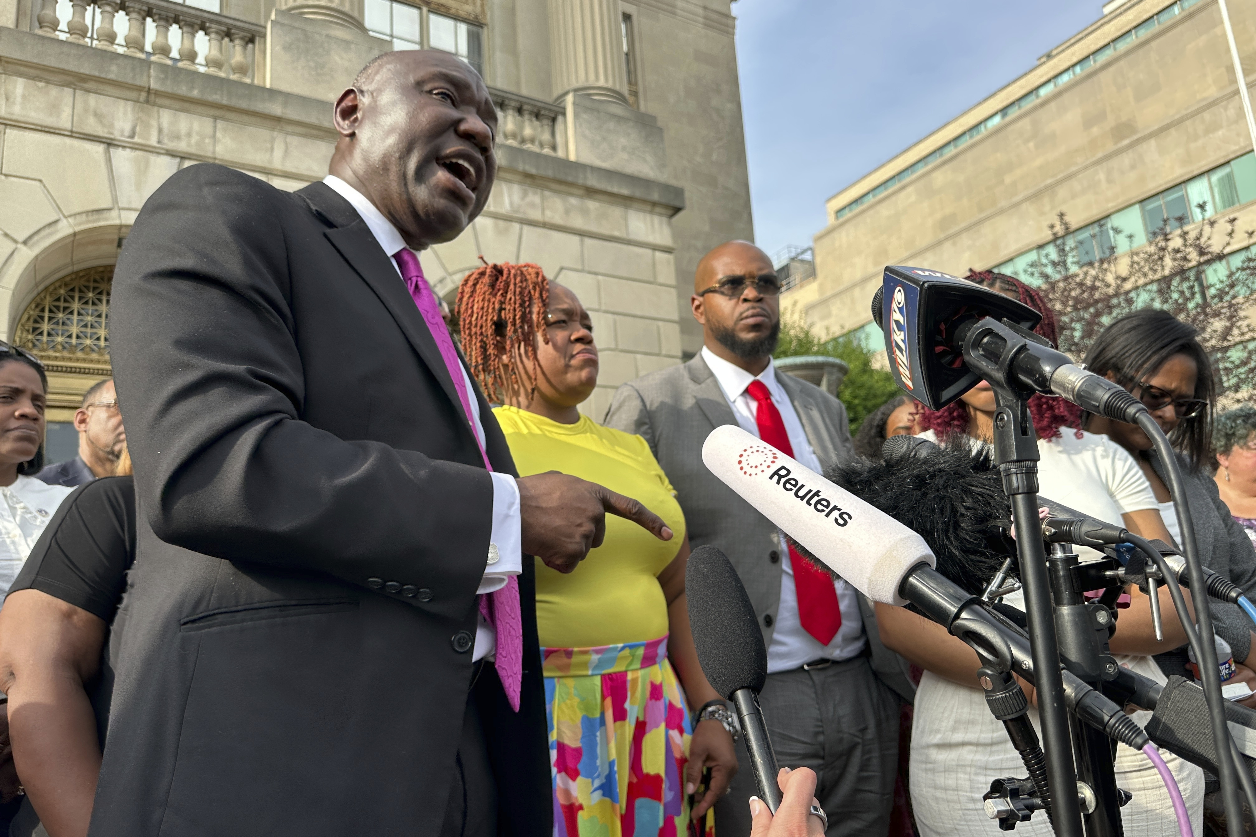 Attorney Ben Crump, left, stands beside Tamika Palmer, mother of Breonna Taylor, center; and Kenneth Walker, Taylor's boyfriend, center right, outside the federal courthouse in Louisville, Ky., Monday, July 21, 2025, after the sentencing of former Louisville Police officer Brett Hankinson in the raid that led to Taylor's death in 2020. (AP photo/Dylan T. Lovan)