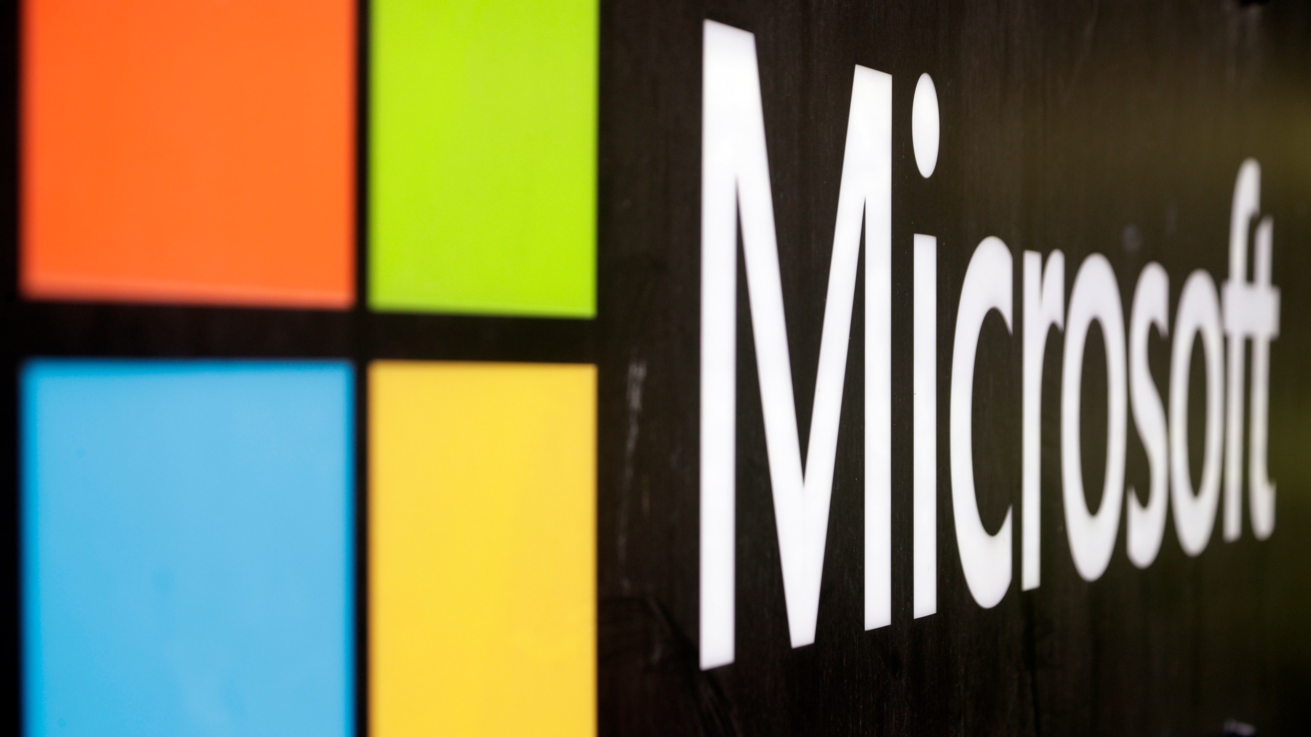 FILE - The Microsoft company logo is displayed at their offices in Sydney, Australia, on Feb. 3, 2021. (AP Photo/Rick Rycroft, File)