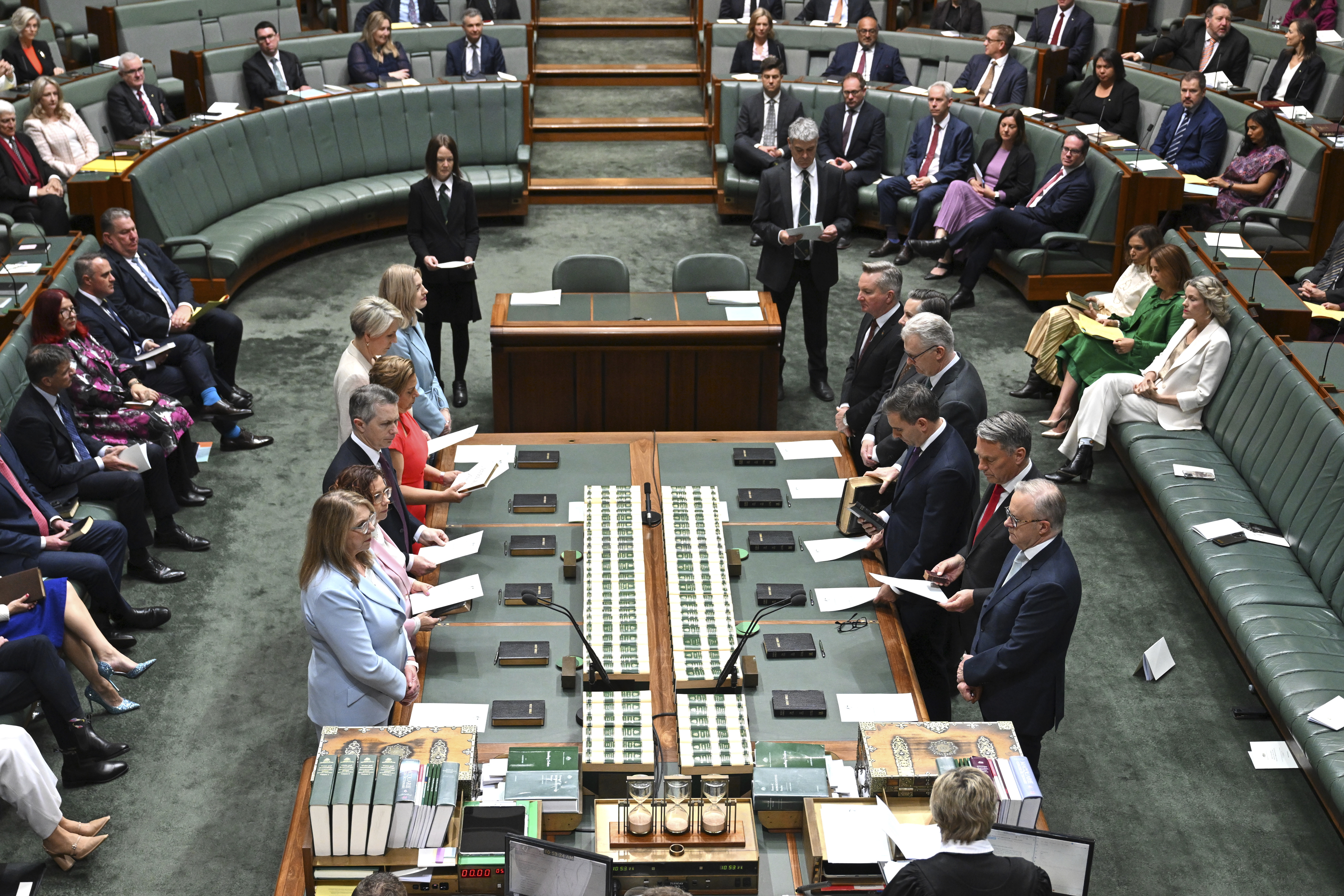 Australian Prime Minister Anthony Albanese, right, and members of his front bench take the oath or affirmation of allegiance during the opening of the 48th Federal Parliament in the House of Representatives at Parliament House in Canberra, Australia, Tuesday, July 22, 2025. (Lukas Coch/AAPImage via AP)