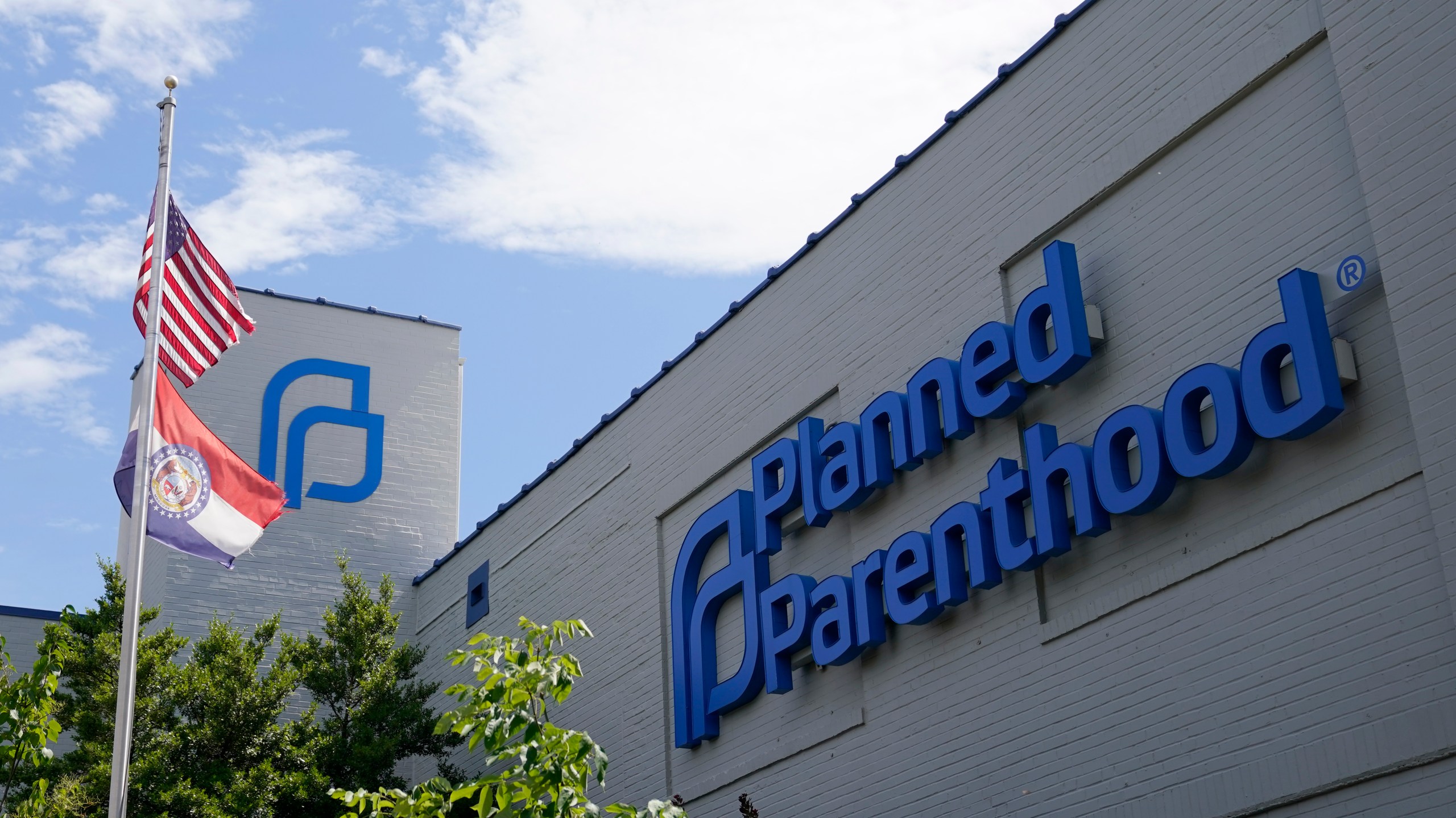 FILE - A Missouri and American flag fly outside Planned Parenthood in St. Louis, June 24, 2022. (AP Photo/Jeff Roberson, File)