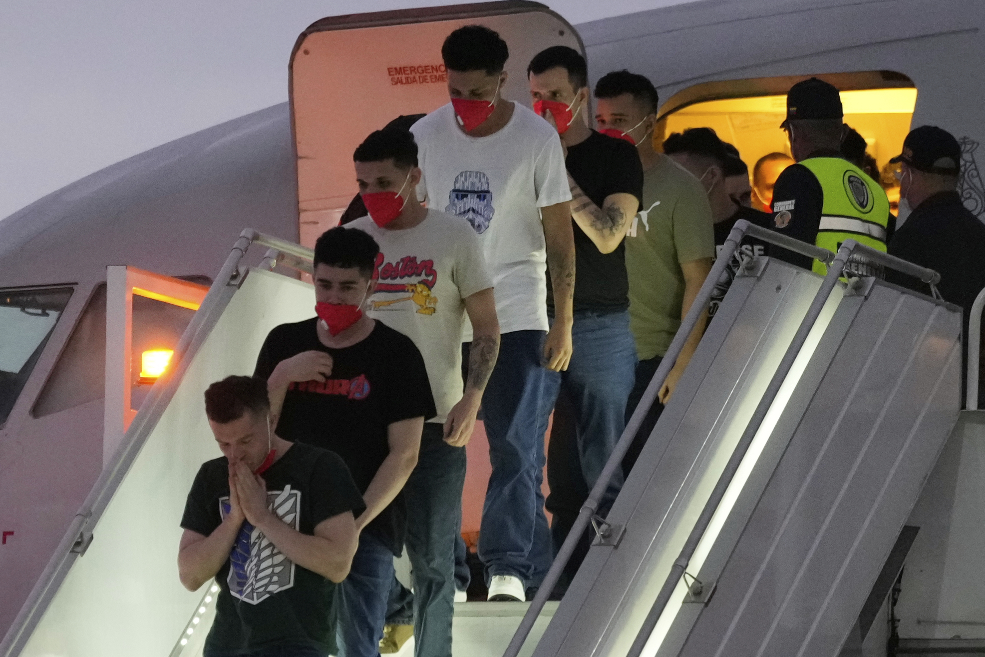 Migrants deported months ago by the United States to El Salvador under the Trump administration's immigration crackdown arrive at Simon Bolívar International Airport in Maiquetia, Venezuela, Friday, July 18, 2025. (AP Photo/Ariana Cubillos)