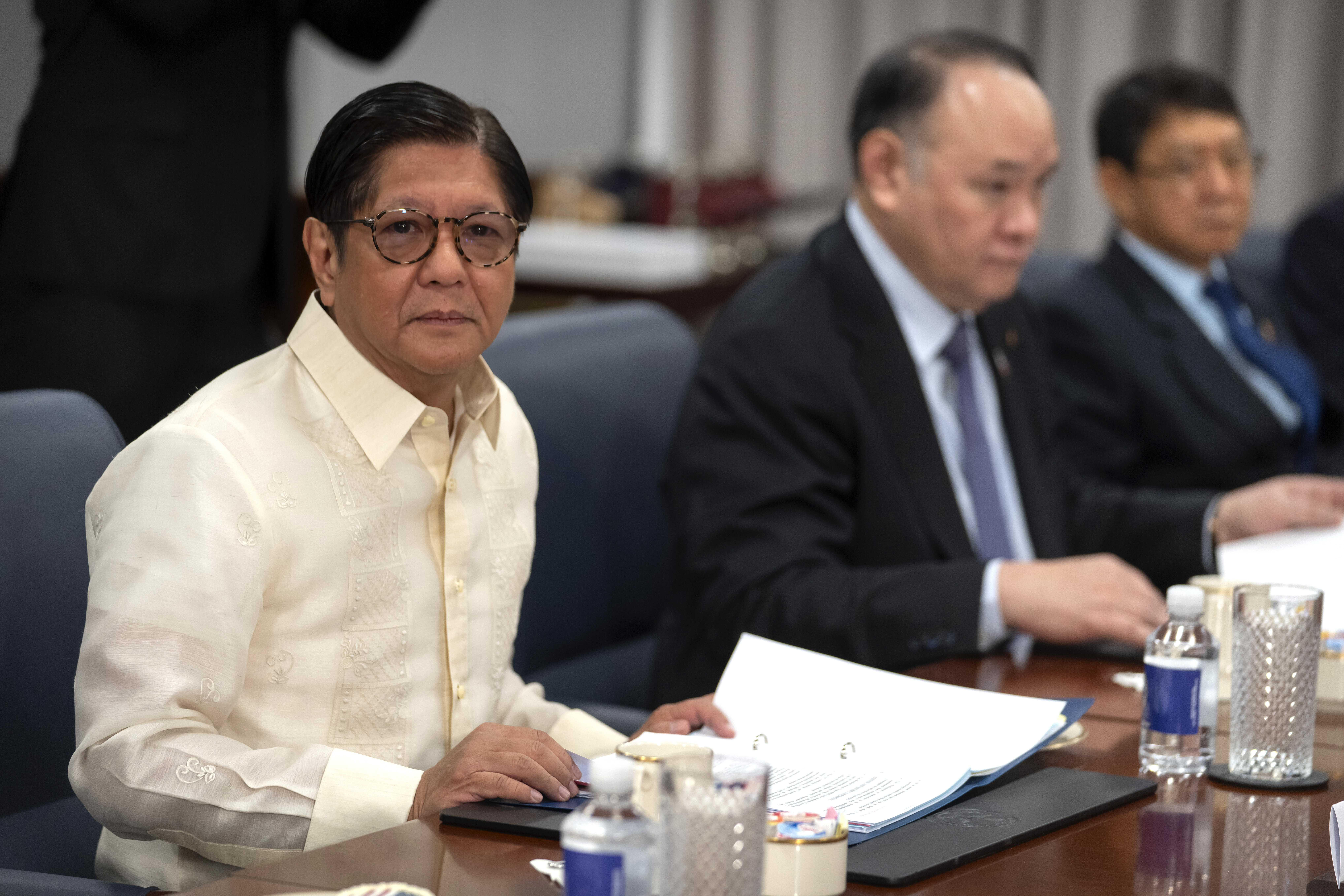 Philippine President Ferdinand Marcos Jr., left, attends a meeting with Secretary of Defense Pete Hegseth at the Pentagon, Monday, July 21, 2025, in Washington. (AP Photo/Mark Schiefelbein)