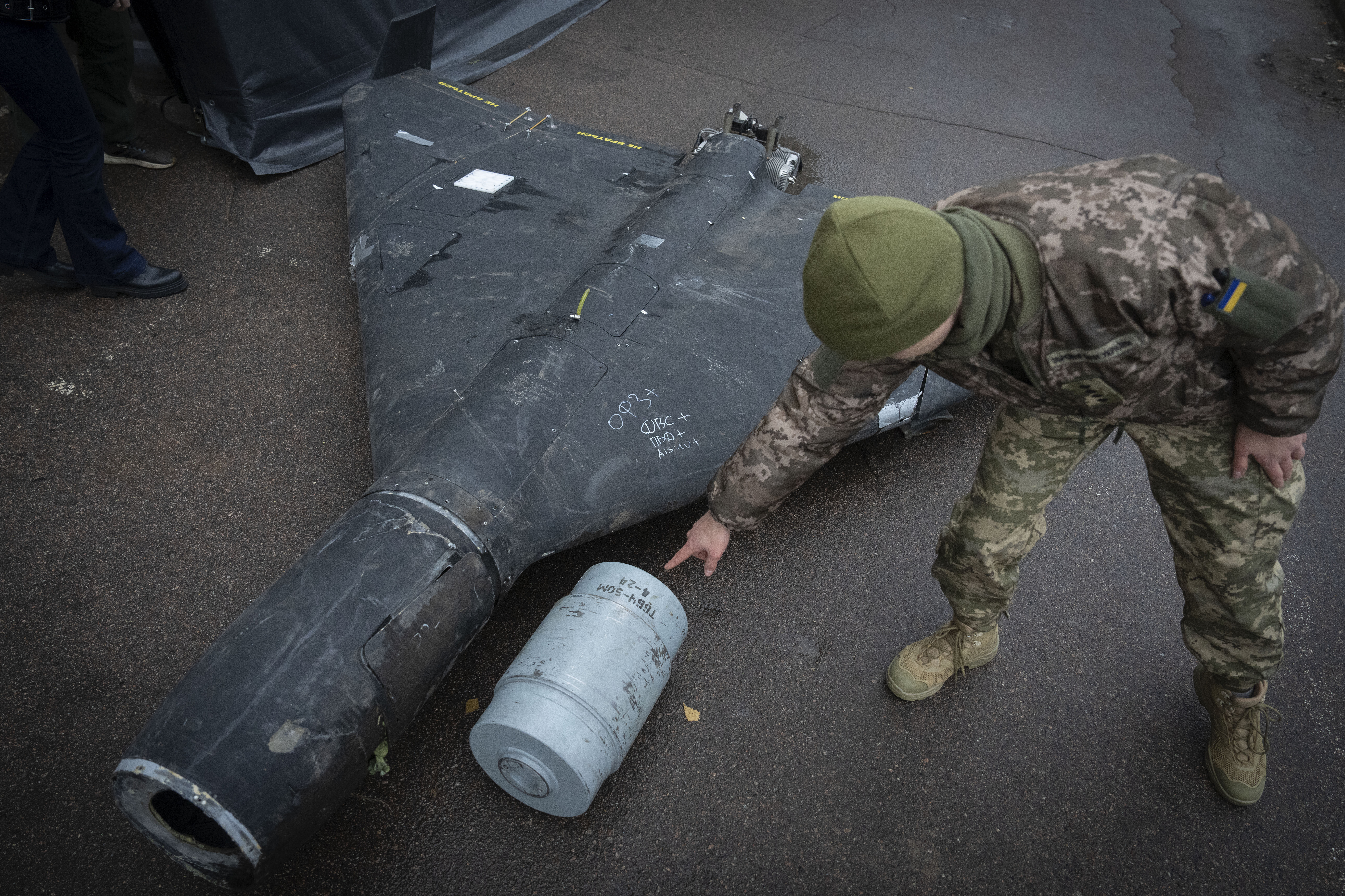 FILE - A Ukrainian officer shows a thermobaric charge from a downed Russian drone in a research laboratory in an undisclosed location in Ukraine on, Nov. 14, 2024. (AP Photo/Efrem Lukatsky, File)