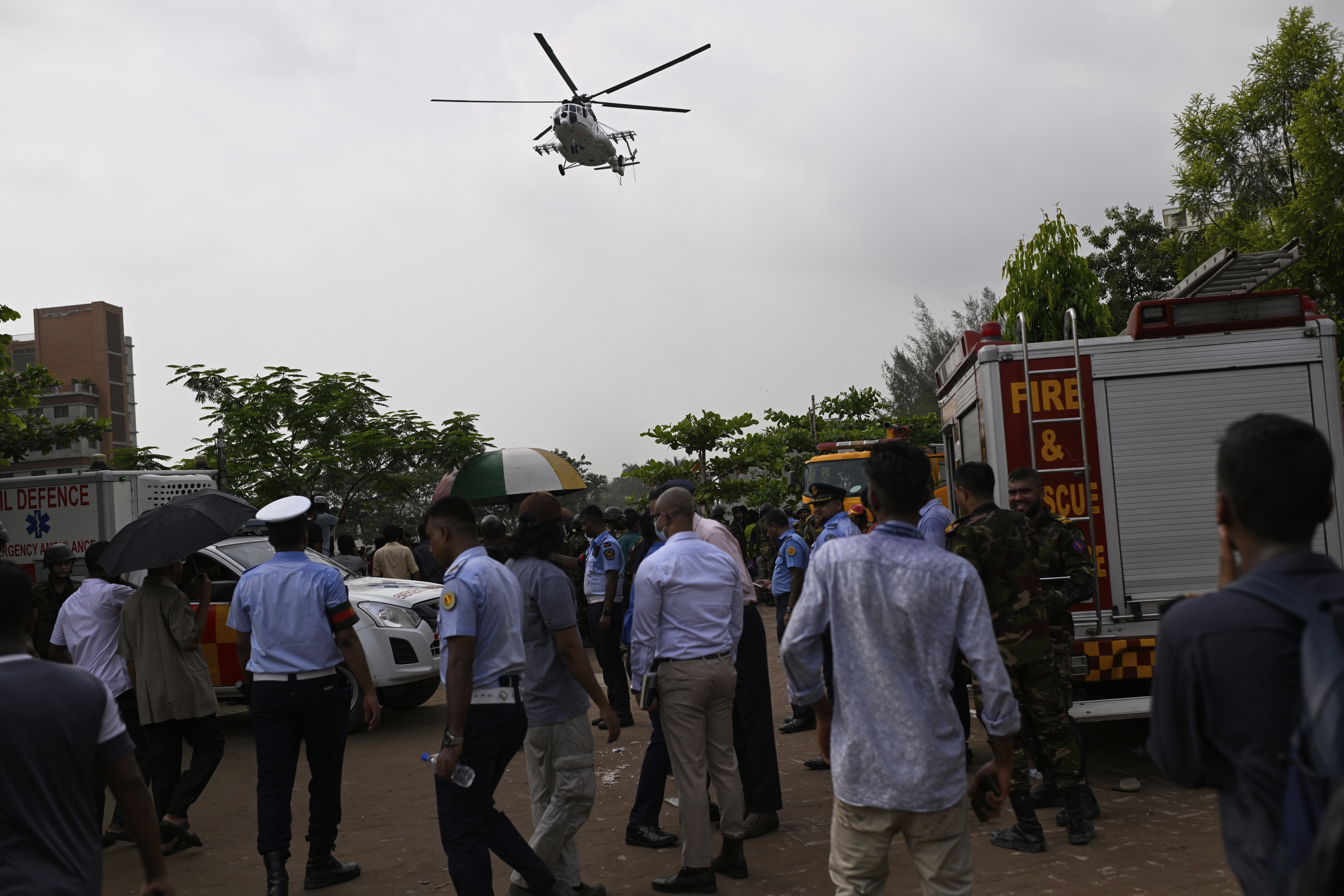 A helicopter carrying injured victims of a Bangladesh Air Force training aircraft crash in Dhaka, Bangladesh, Monday, July 21, 2025. (AP Photo/Mahmud Hossain Opu)