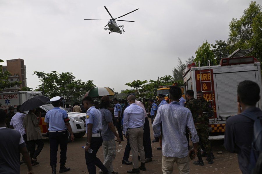 A helicopter carrying injured victims of a Bangladesh Air Force training aircraft crash in Dhaka, Bangladesh, Monday, July 21, 2025. (AP Photo/Mahmud Hossain Opu)