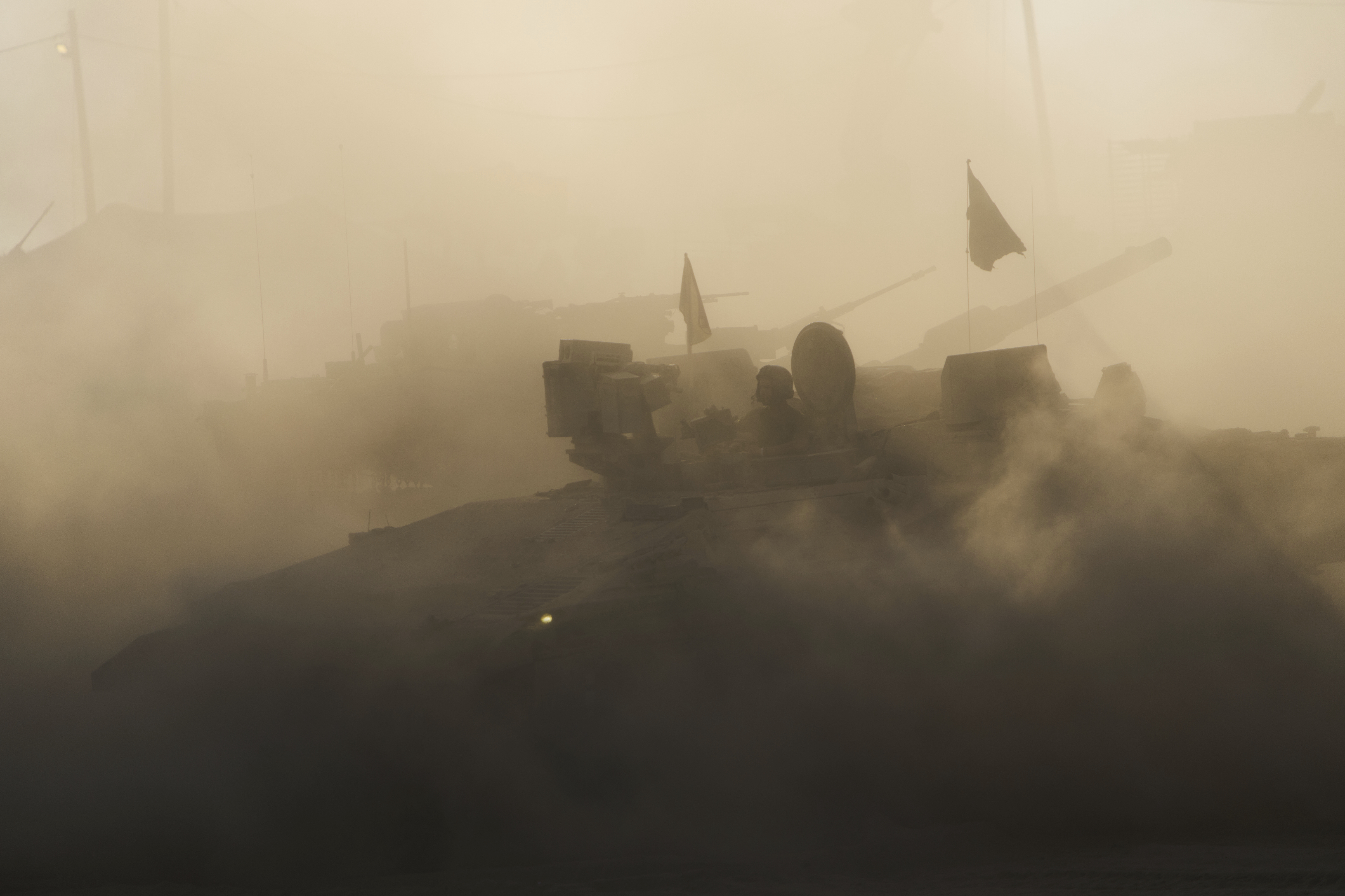 An Israeli military APC maneuvers at a gathering point near the Gaza Strip, in southern Israel, July 21, 2025. (AP Photo/Ariel Schalit)