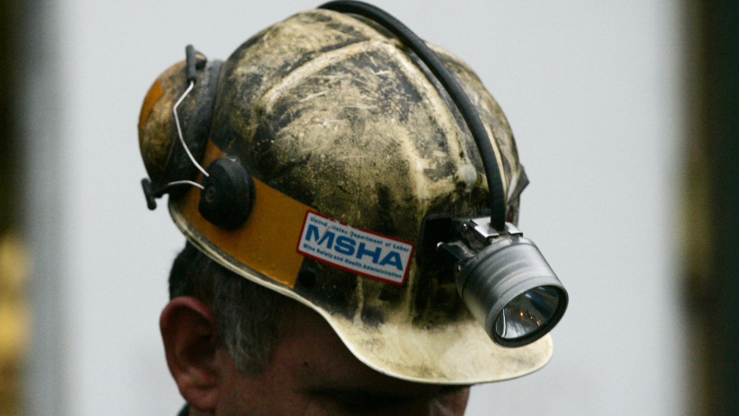 FILE - A miner gathers his thought before taking part in a rescue mission, Jan. 3, 2006, in Tallmansville, W.Va.. (AP Photo/Haraz N. Ghanbari, Pool, File)
