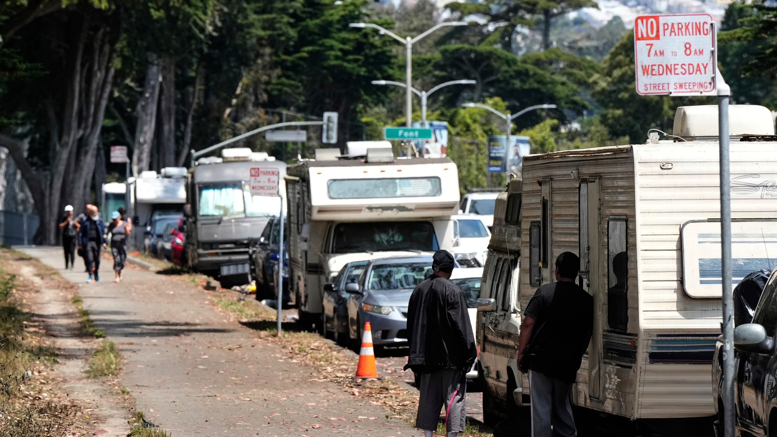 Parked RVs are seen on Lake Merced Boulevard in San Francisco, Tuesday, July 15, 2025. (AP Photo/Godofredo A. Vásquez)