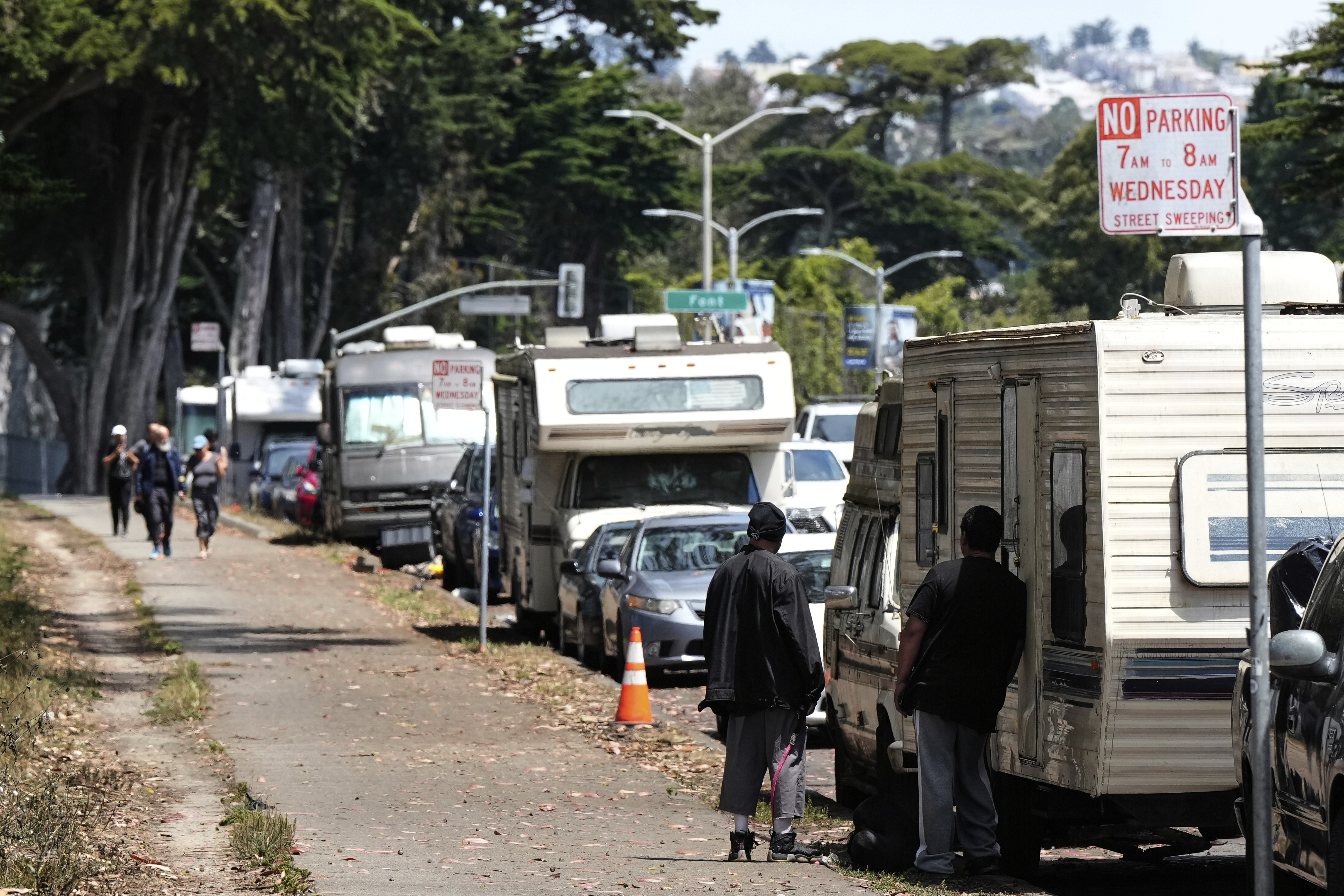 Parked RVs are seen on Lake Merced Boulevard in San Francisco, Tuesday, July 15, 2025. (AP Photo/Godofredo A. Vásquez)